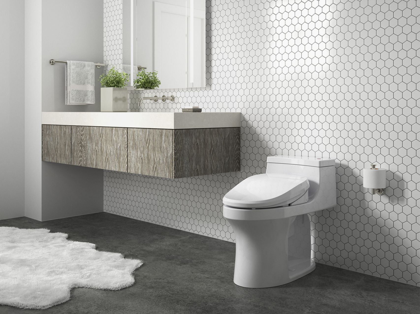 Angled view of a C3-155 bidet seat on a toilet.