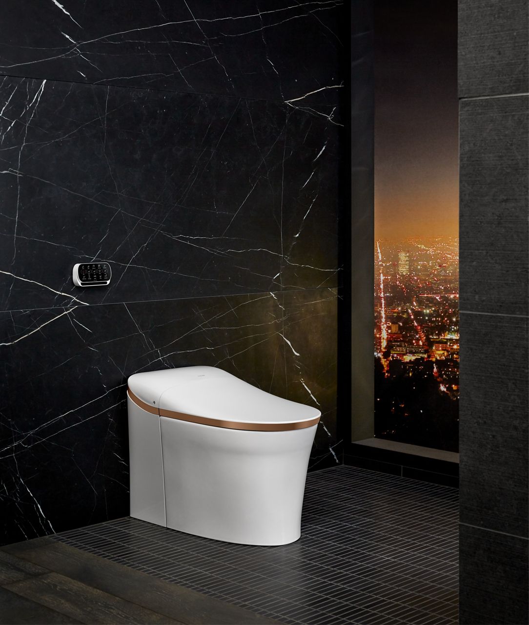 An Eir intelligent toilet with a gold rim band.