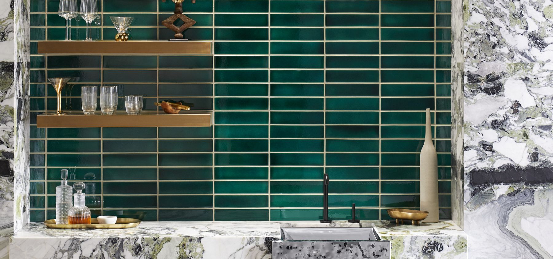 KOHLER WasteLAB® Crackle Tile Collection with glossy green tiles and decorative accents.