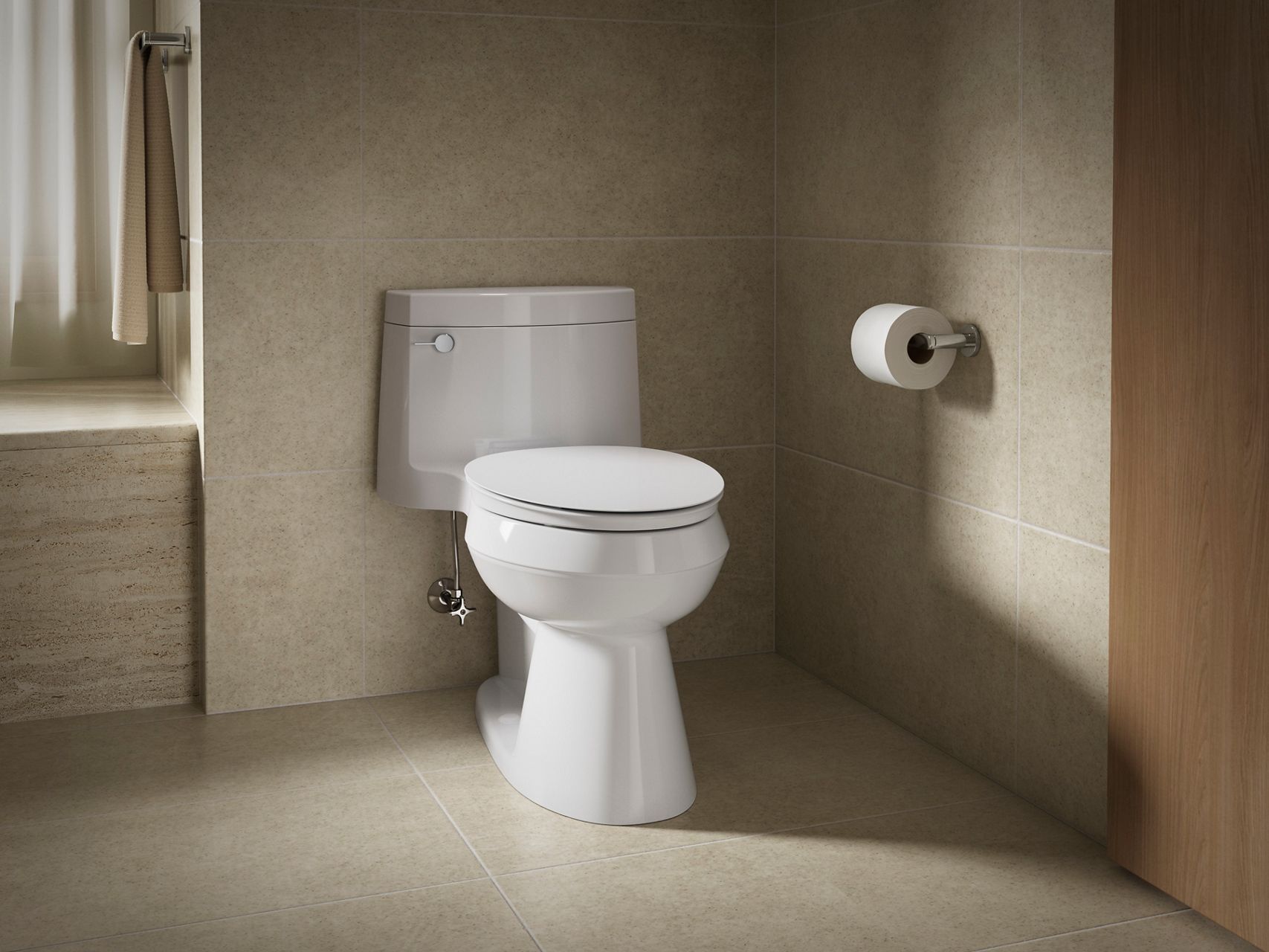 A white toilet with a modern design against a beige wall and tiled floor.