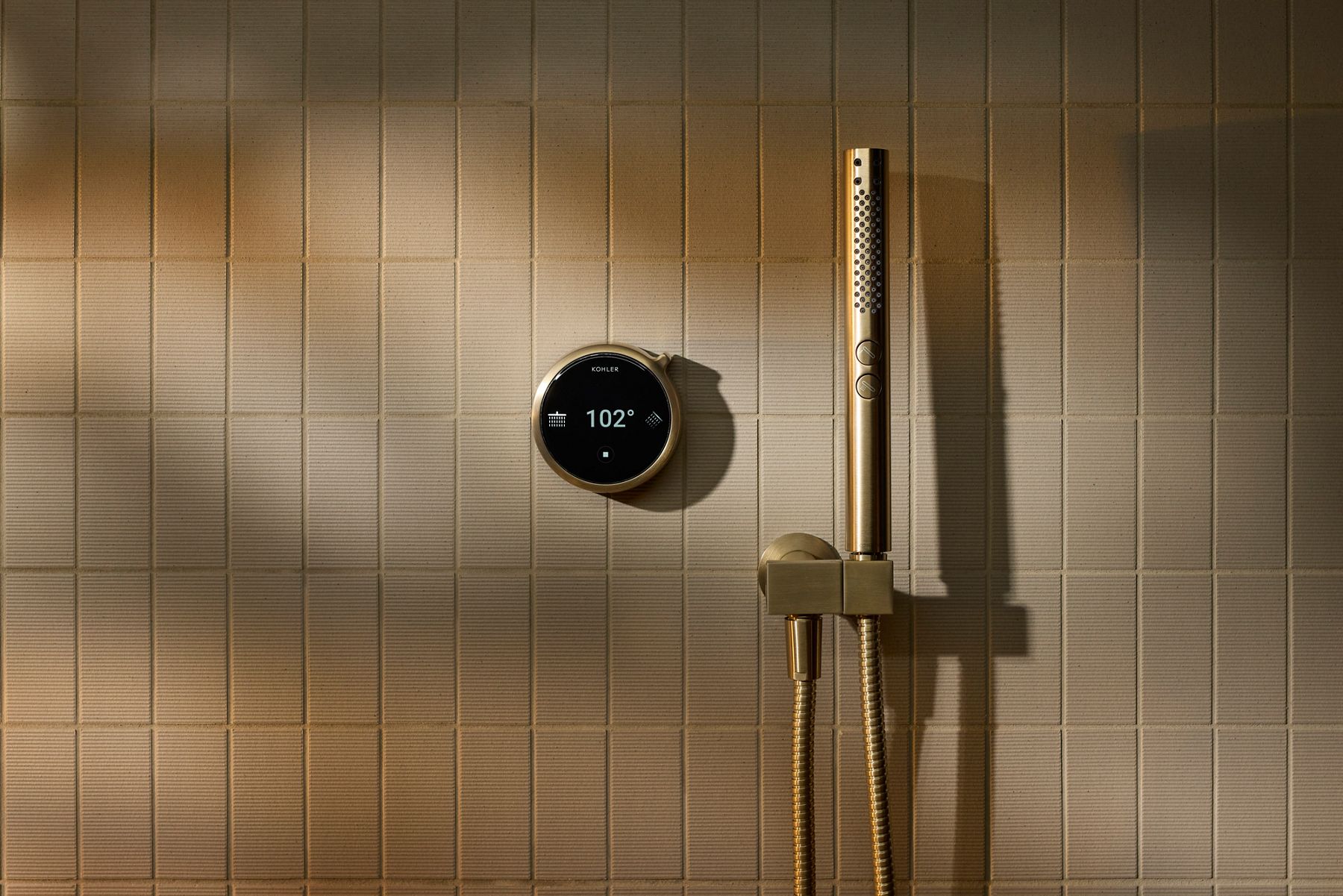 Contemporary shower area with a vertical handheld showerhead and digital temperature control.