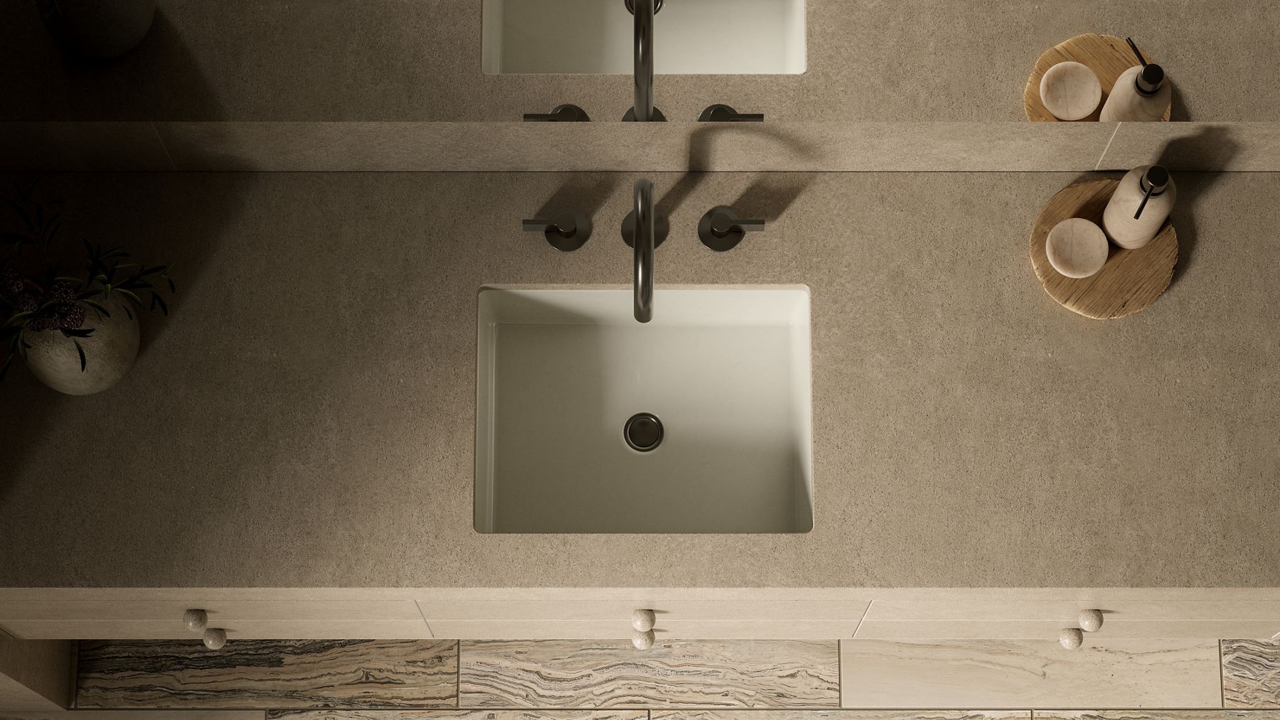 Matte black faucet mounted over a rectangular bathroom sink.