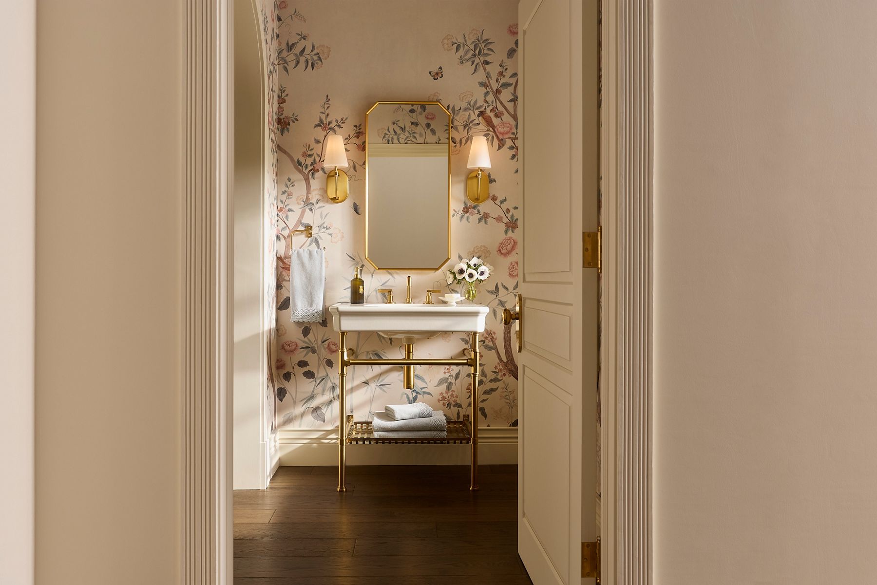 Claude by Studio McGee rectangular console table sink in gold with matching mirror and faucet finishes.