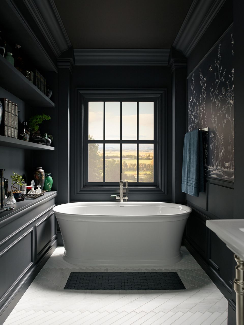 Overhead view of Kohler Margaux widespread bathroom sink faucet with deco lever handles on pedestal sink under wall sconces