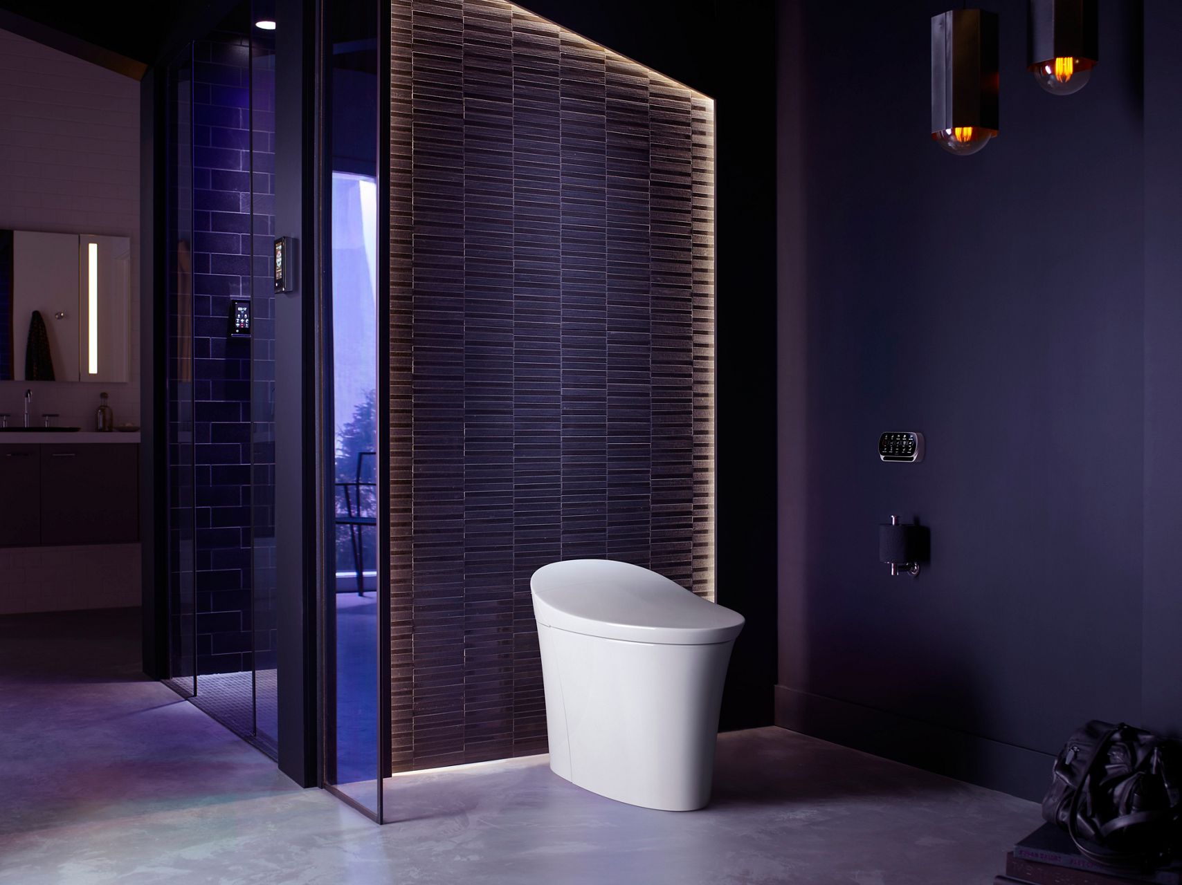A white smart toilet in a bathroom with dark violet walls.