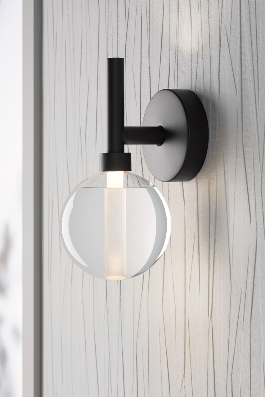 A Kohler Components wall sconce with matte black finish