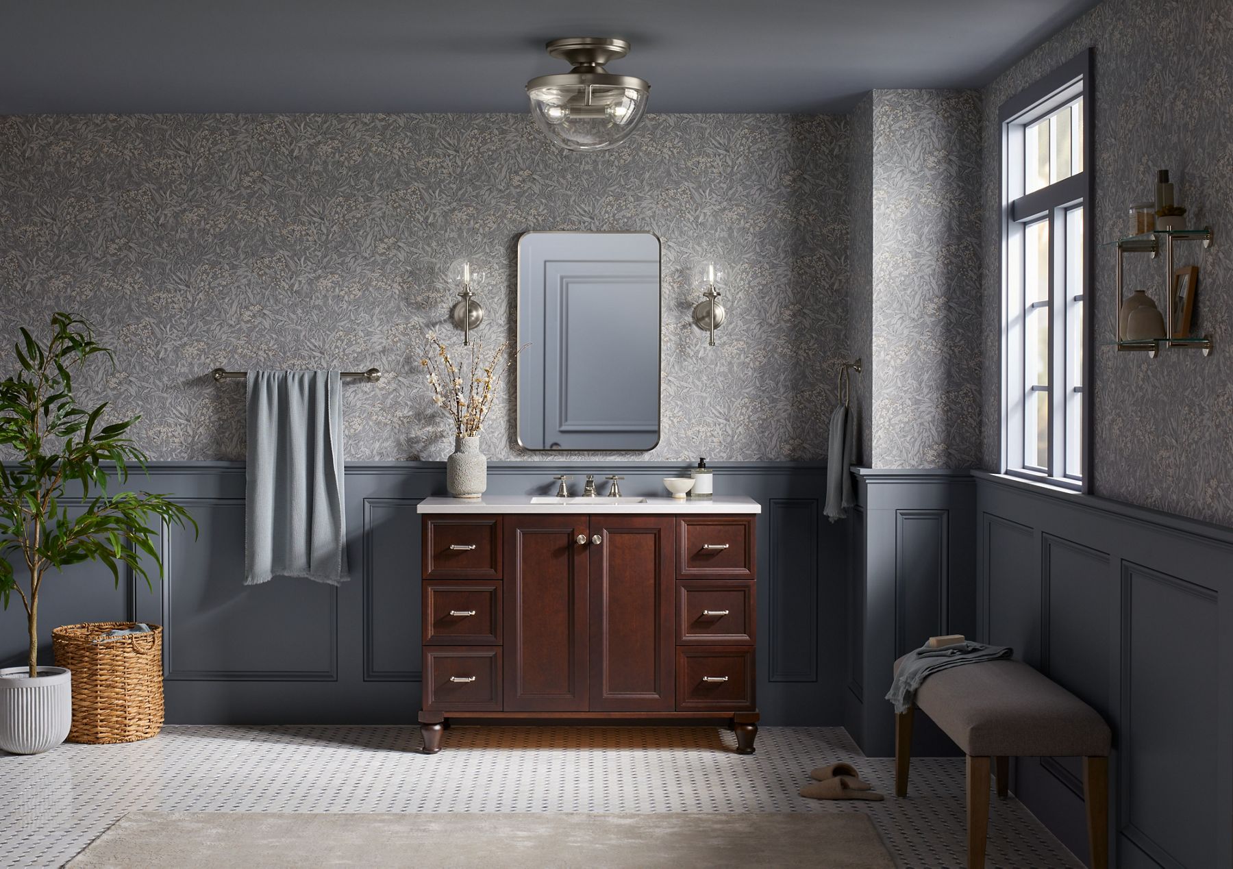 A KOHLER Bellera flush-mount fixture with clear glass domed shade installed on a gray ceiling.