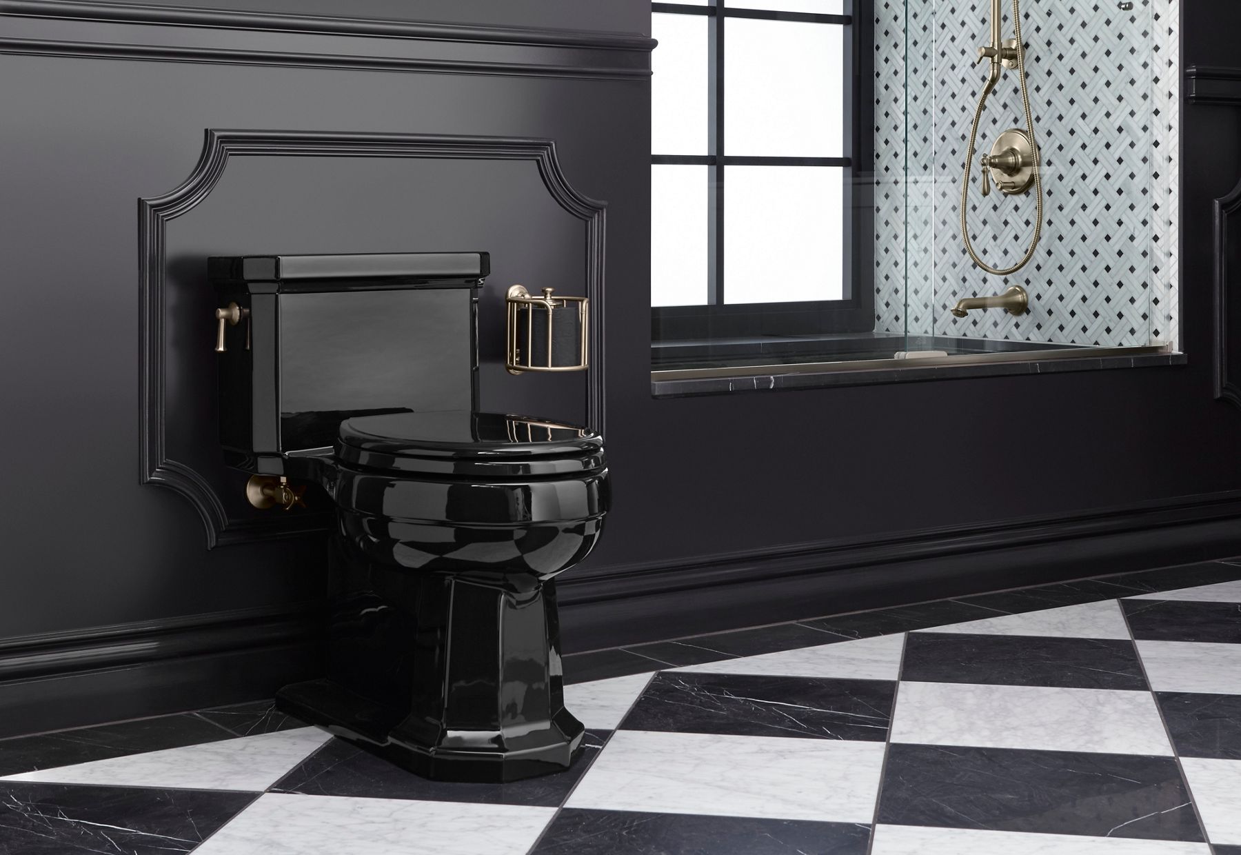 A bathroom in dark hues with brushed bronze fittings and a glossy black Kathryn collection toilet.