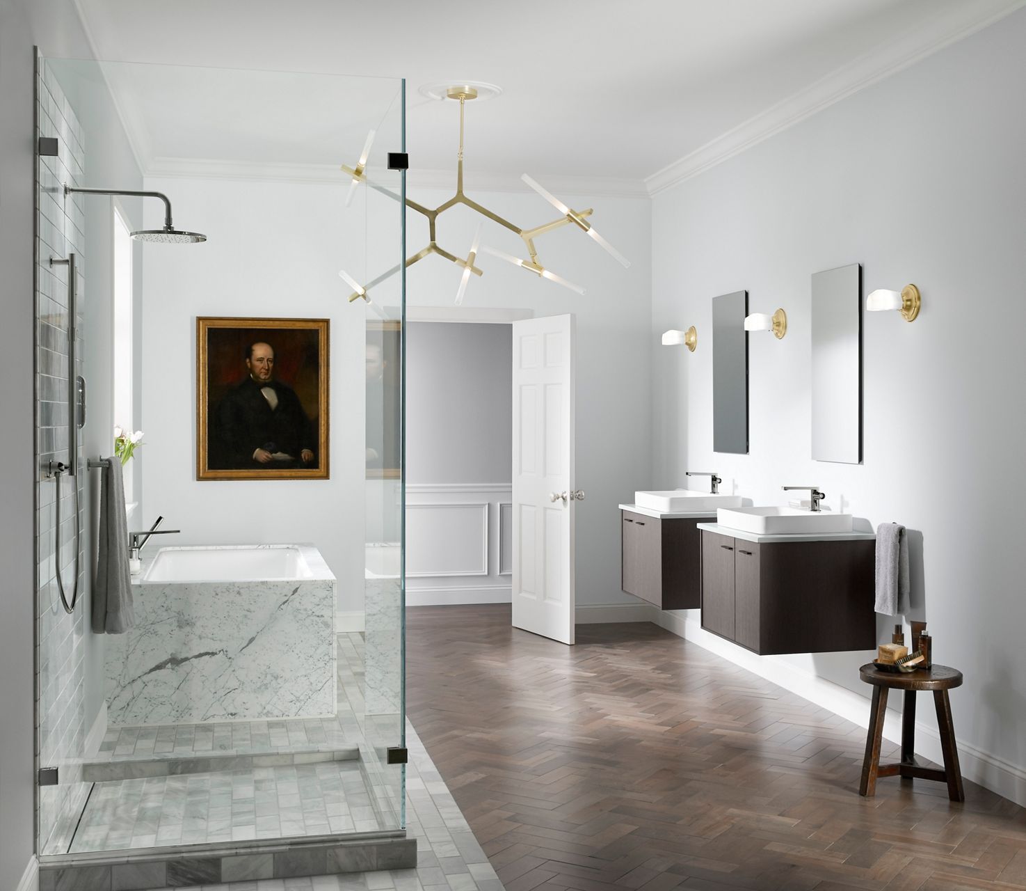 A bathroom in shades of white and light gray with a glassed-in shower area and two floating vanities with Components collection products.