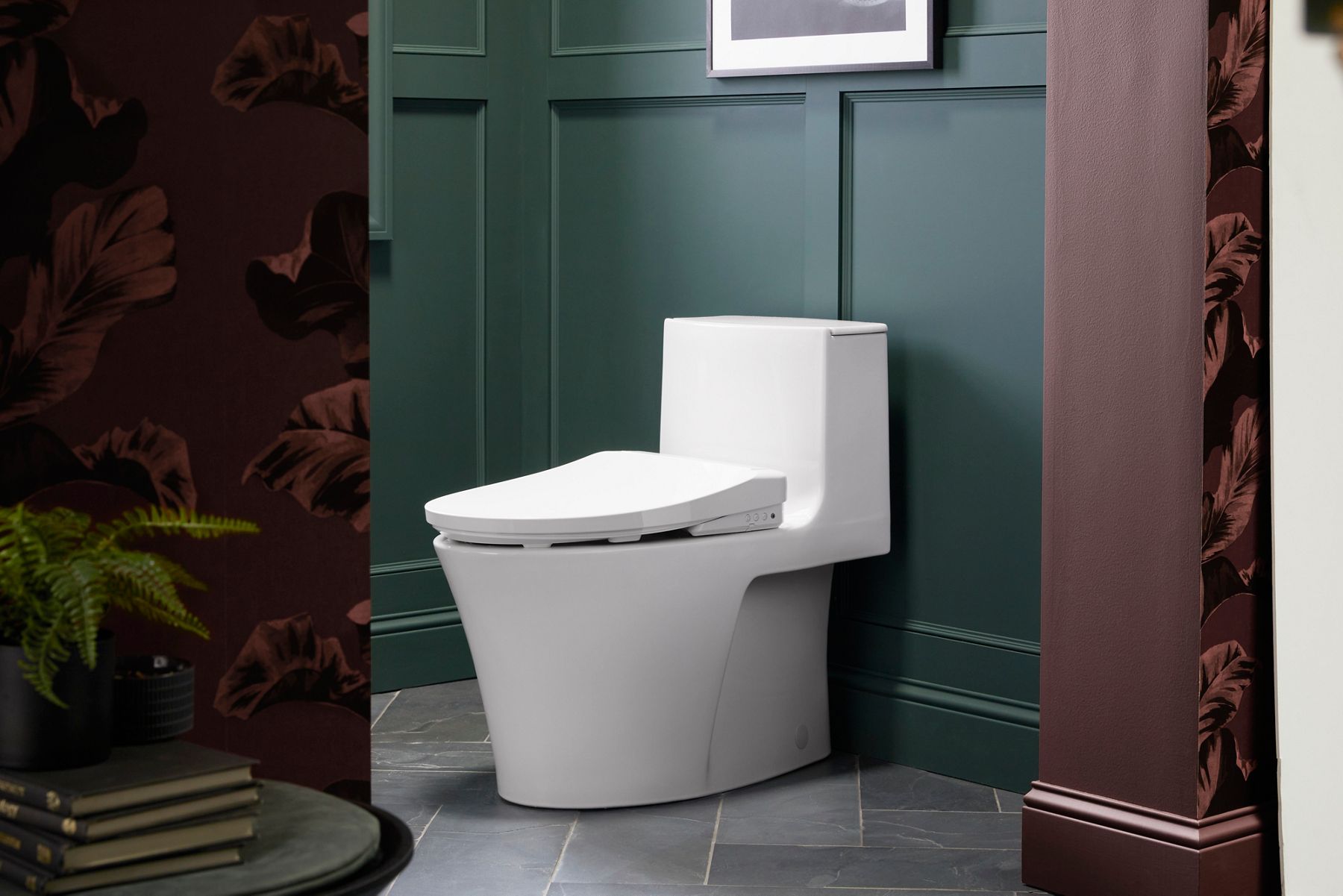 White traditional toilet against textured beige wall