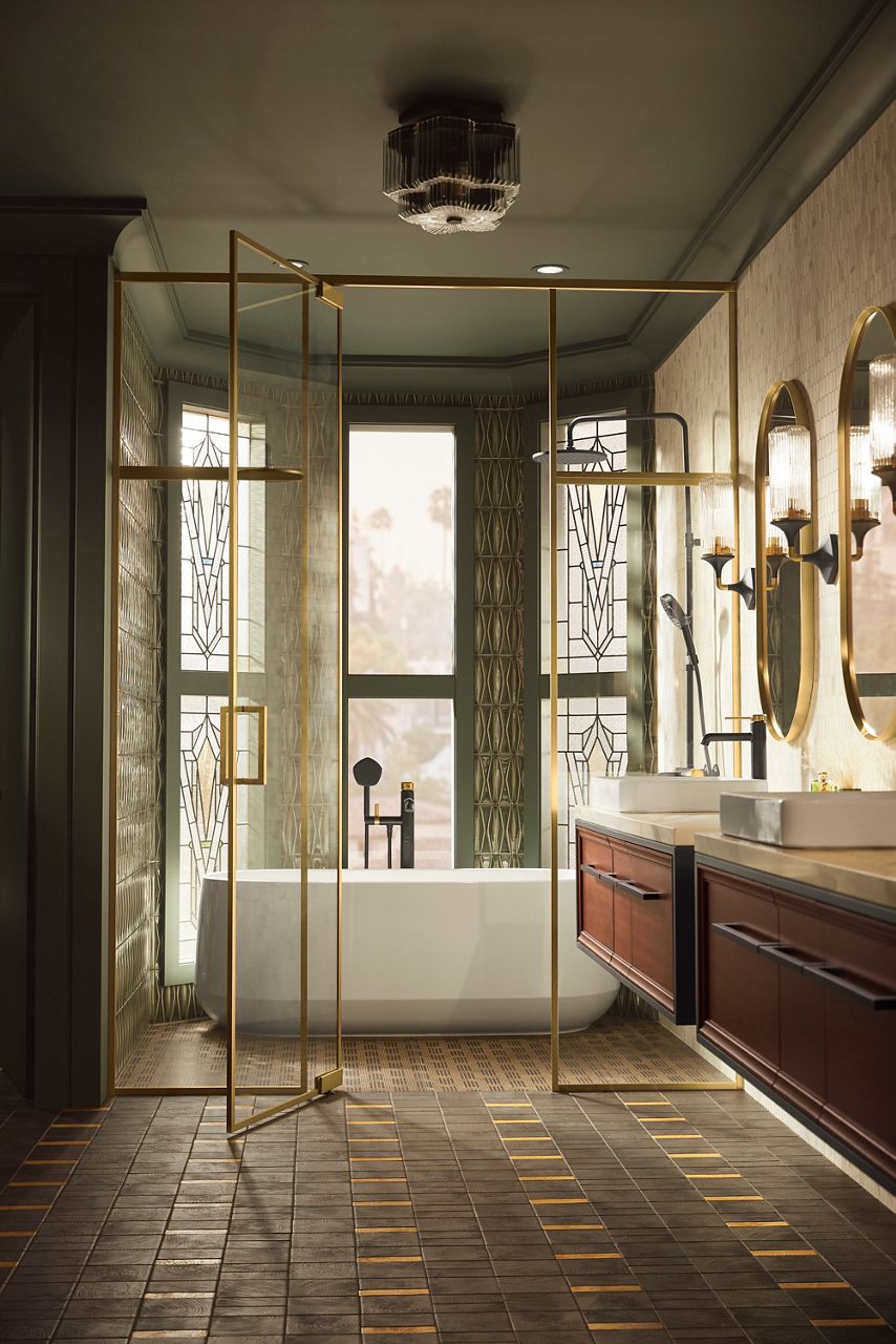 A bright bathroom with a large window on the back wall and freestanding bath full of water in front of the window, and a double wood vanity with matching mirrors on the right.
