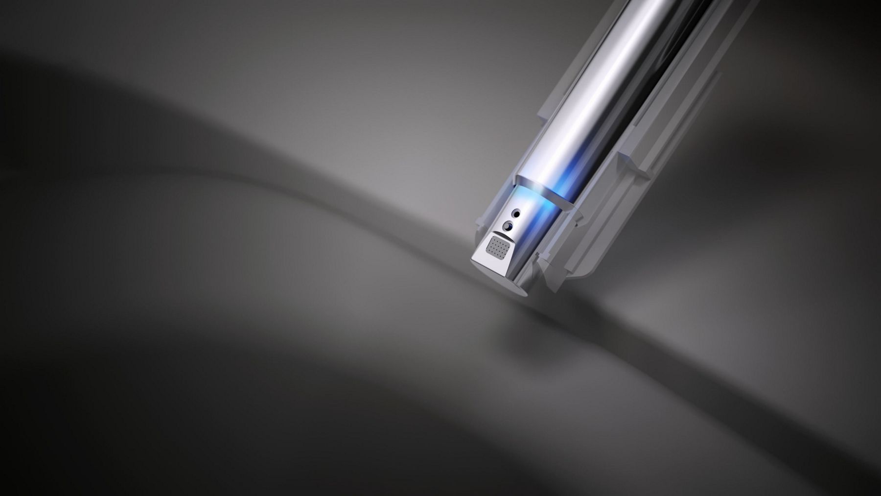 Close-up of a bidet nozzle inside a white toilet bowl.