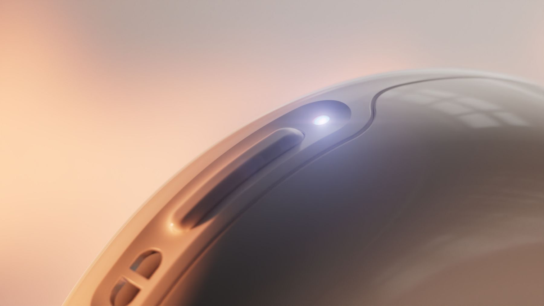 Close-up of the magnetic charging port on the Kohler Health Dekoda device with an illuminated charging indicator.
