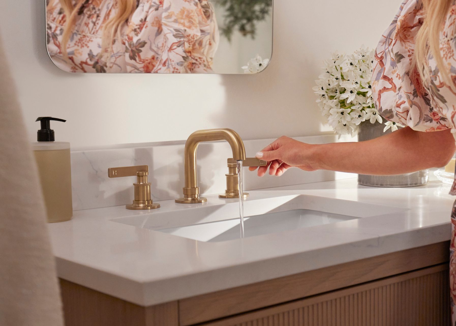 Casita widespread bathroom faucet by designer Shea McGee installed in a white bathroom sink.