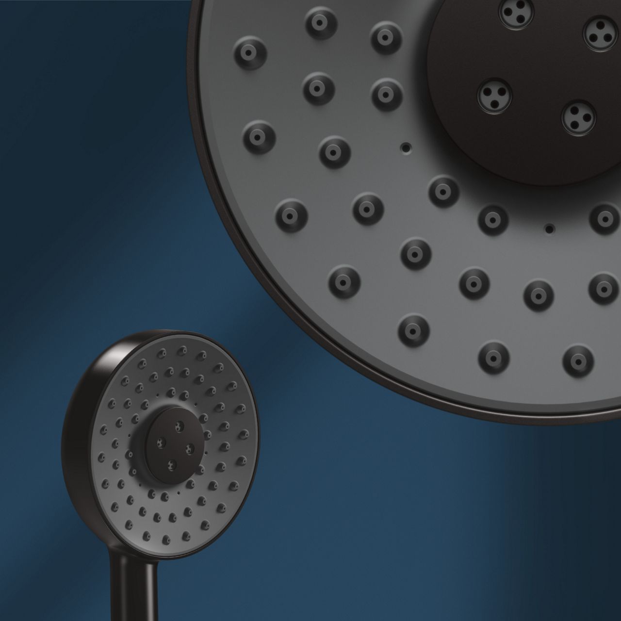 A round Matte Black KOHLER Statement handshower in a blue shower, with a detail view of the water nozzles