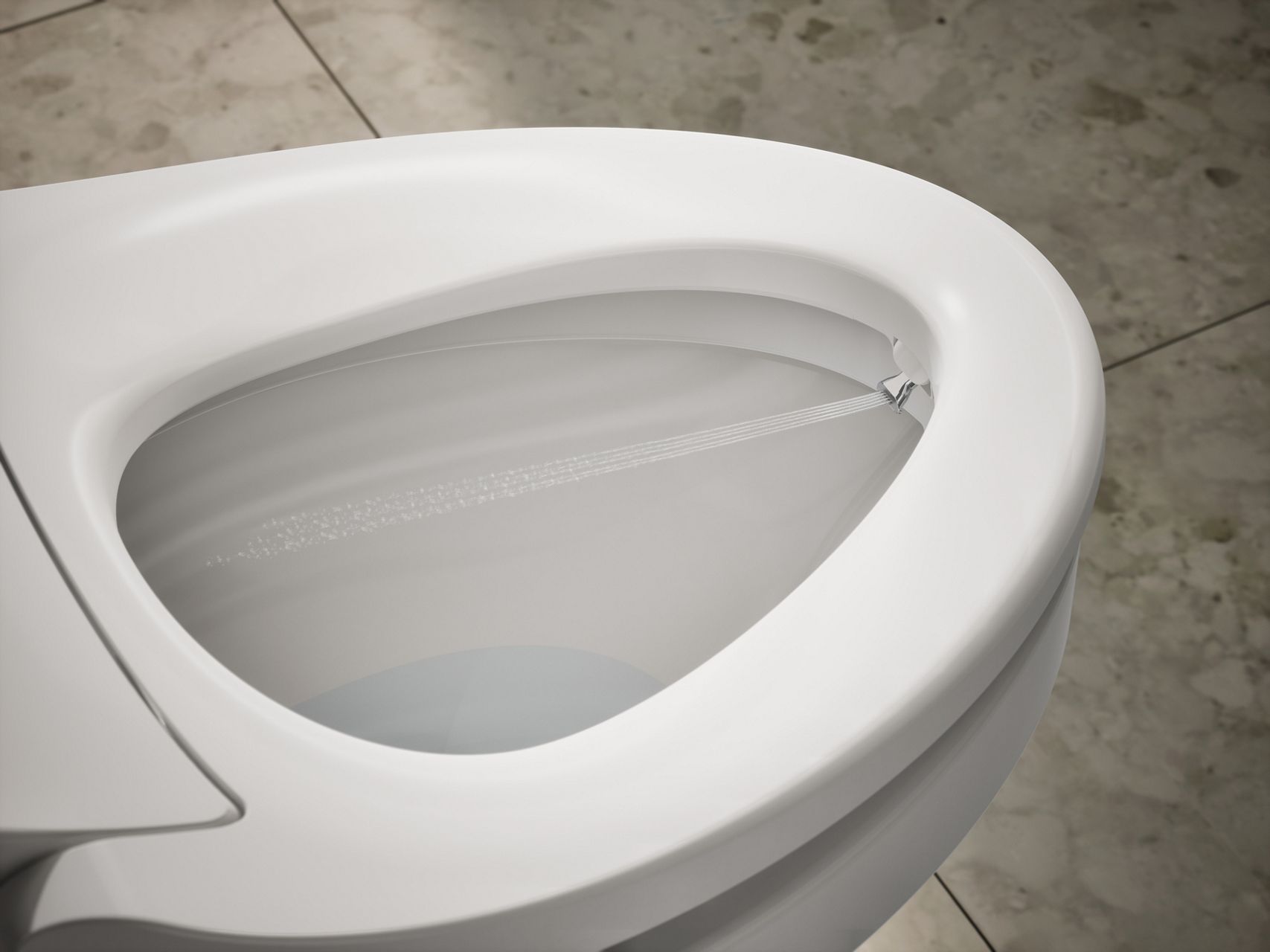 Close up view of a bidet seat nozzle spraying water inside a toilet bowl