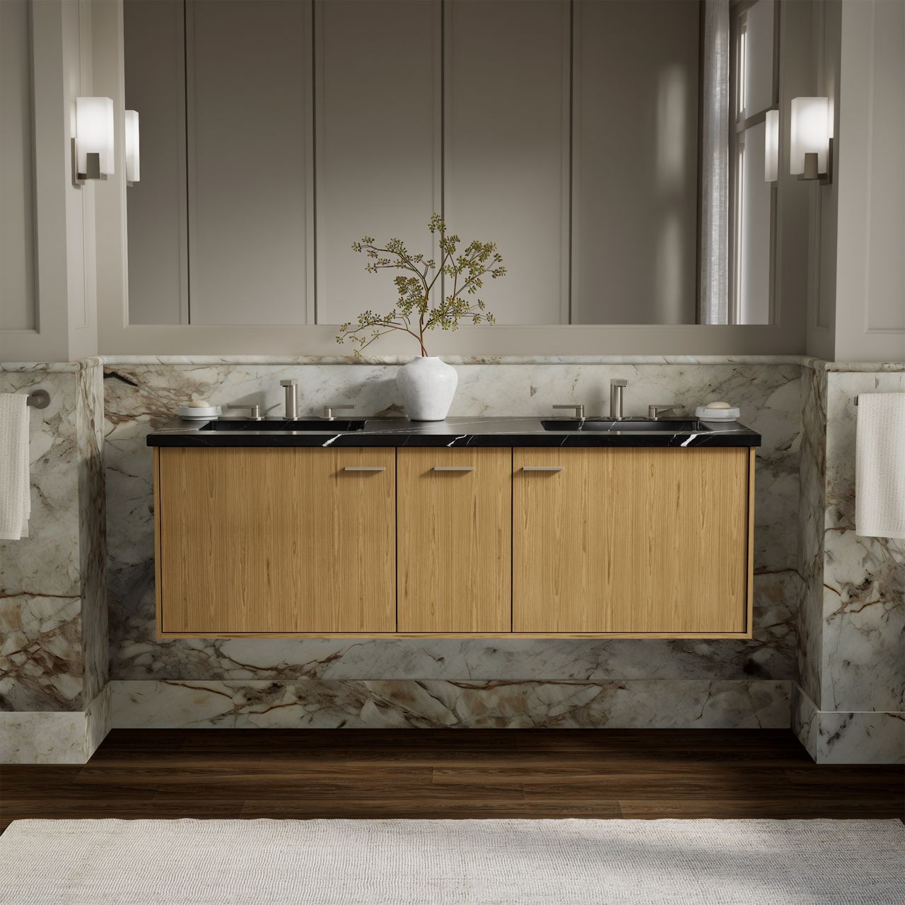 Floating wood vanity with a black countertop and integrated sinks, accented by dramatic marble wall panels in a contemporary bathroom.
