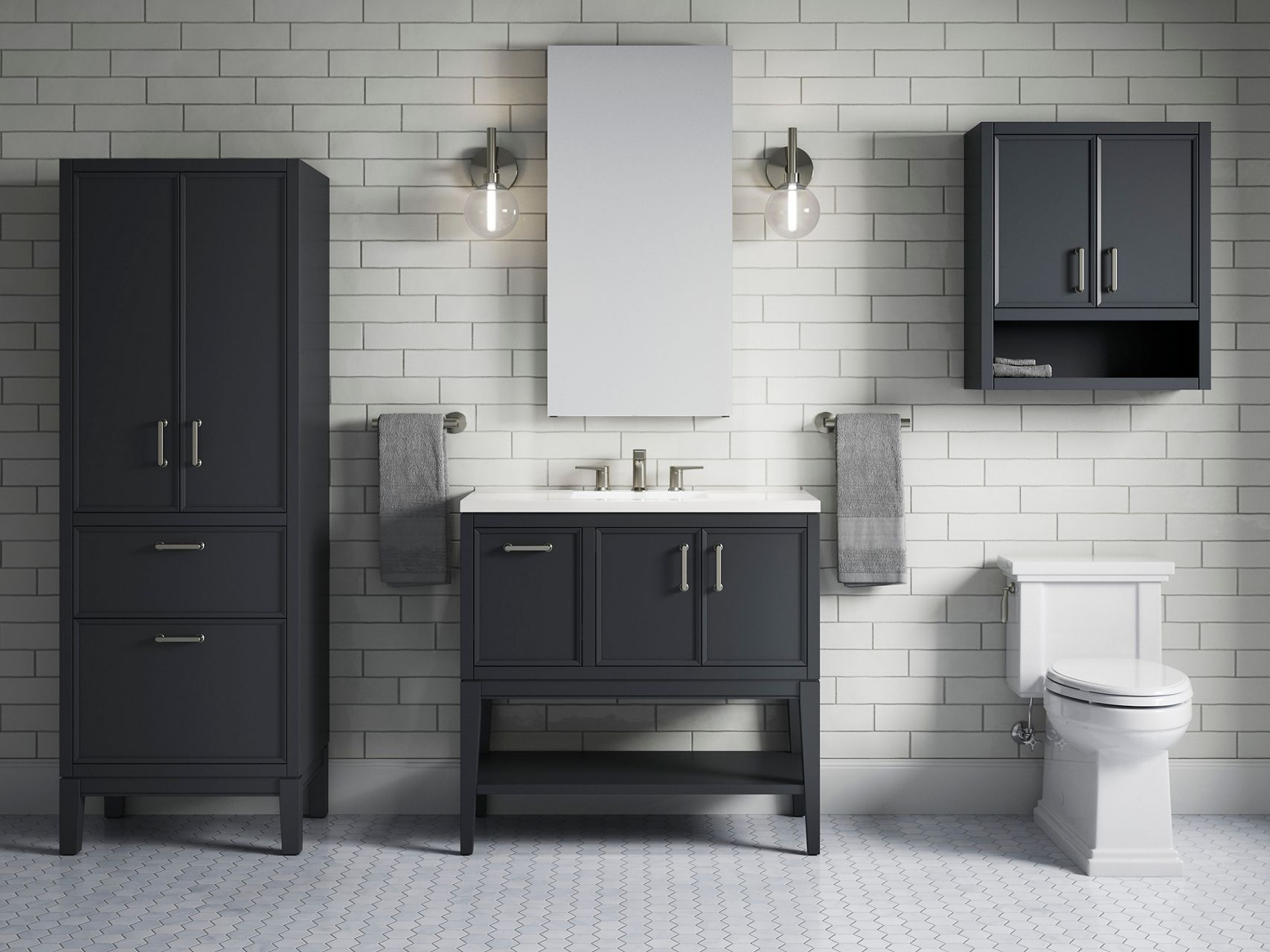 A dark gray wall-mount cabinet installed over a white toilet with a matching gray vanity to the left.