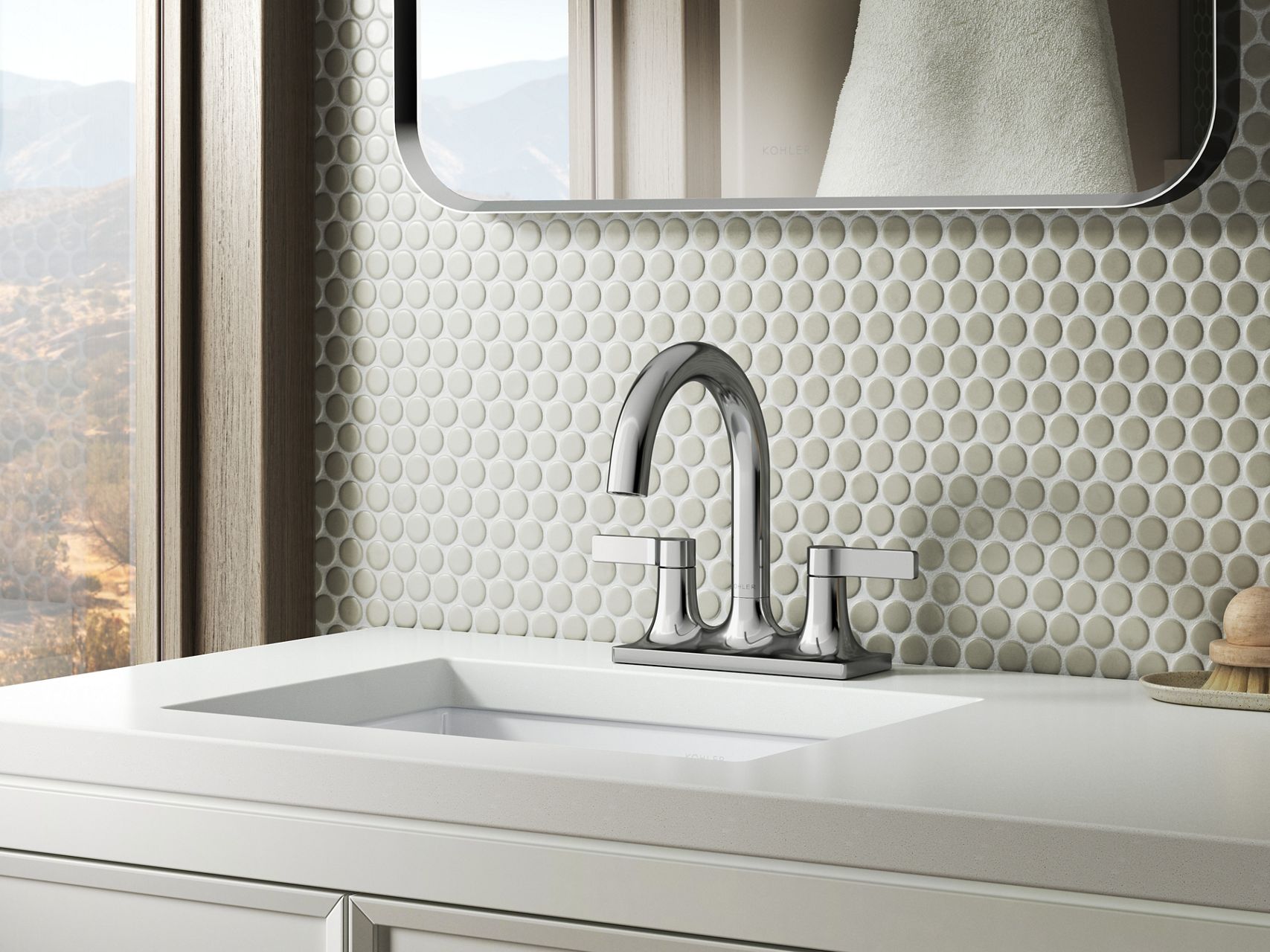 Center set bathroom faucet with spout and handles on a single base plate.