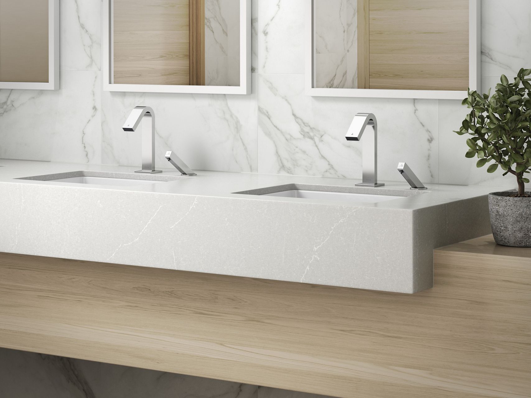 A modern vanity area with a raised stone sink area set in a wood cabinet with a chrome faucet and soap dispenser.