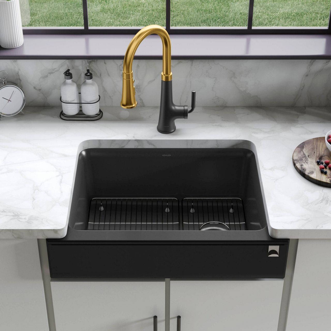 A KOHLER kitchen sink in a matte black Neoroc composite material.