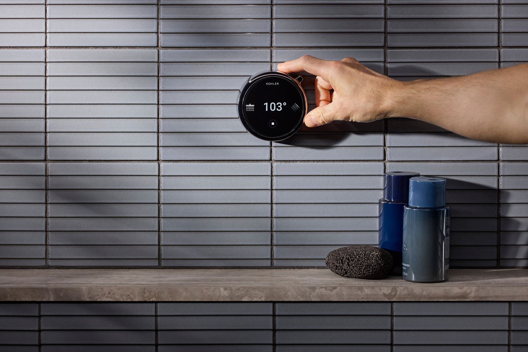 Round digital dial displaying water temperature at 103 degrees.