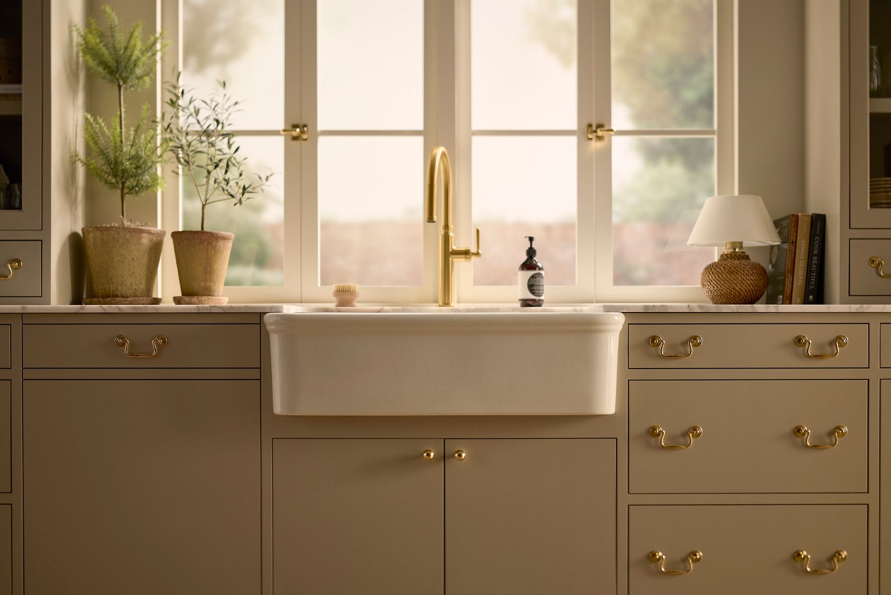 A KOHLER farmhouse kitchen sink in fireclay material.