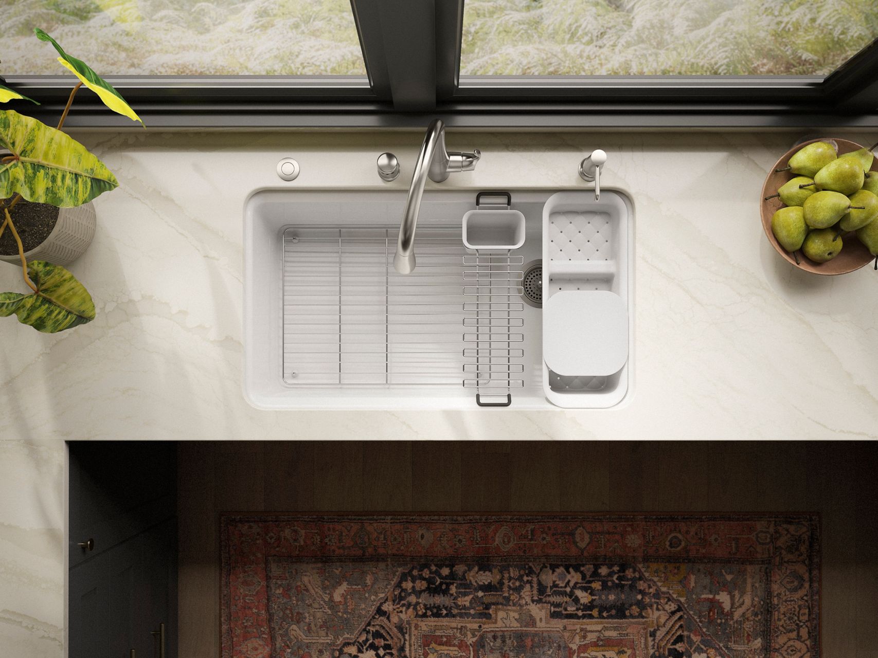 Top-down view of an undermount kitchen sink with accessories, including a drying rack and tray.