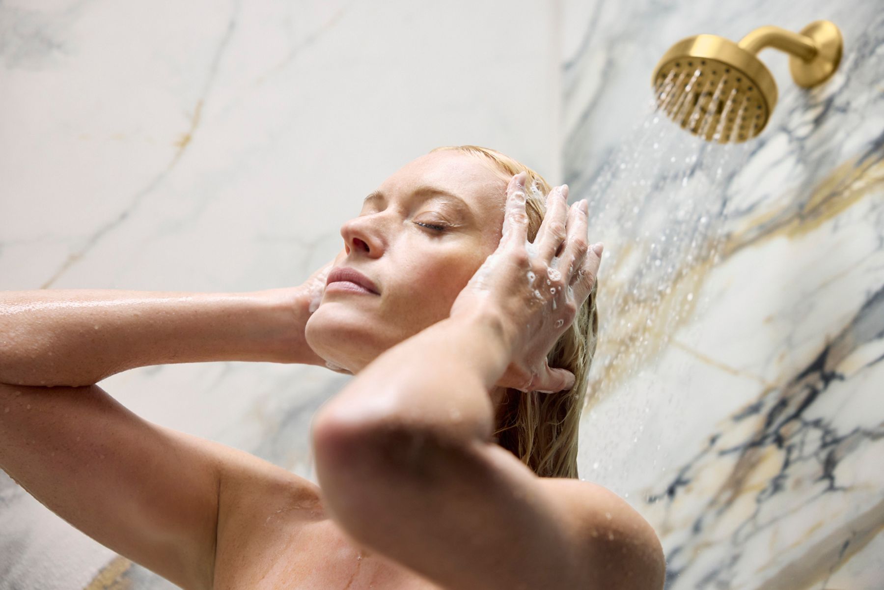 Woman in a Kohler shower