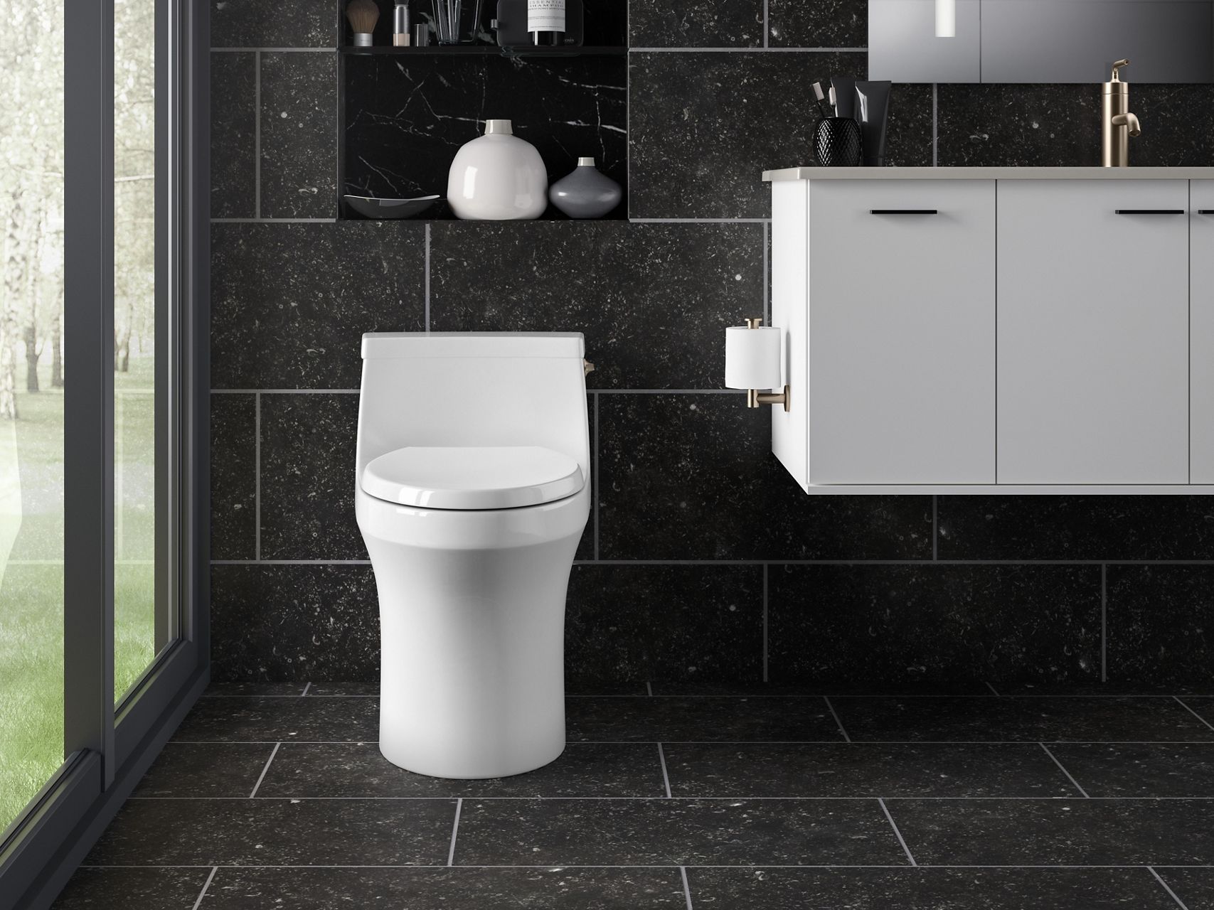 KOHLER compact, skirted toilet with vanity in high contrast bathroom