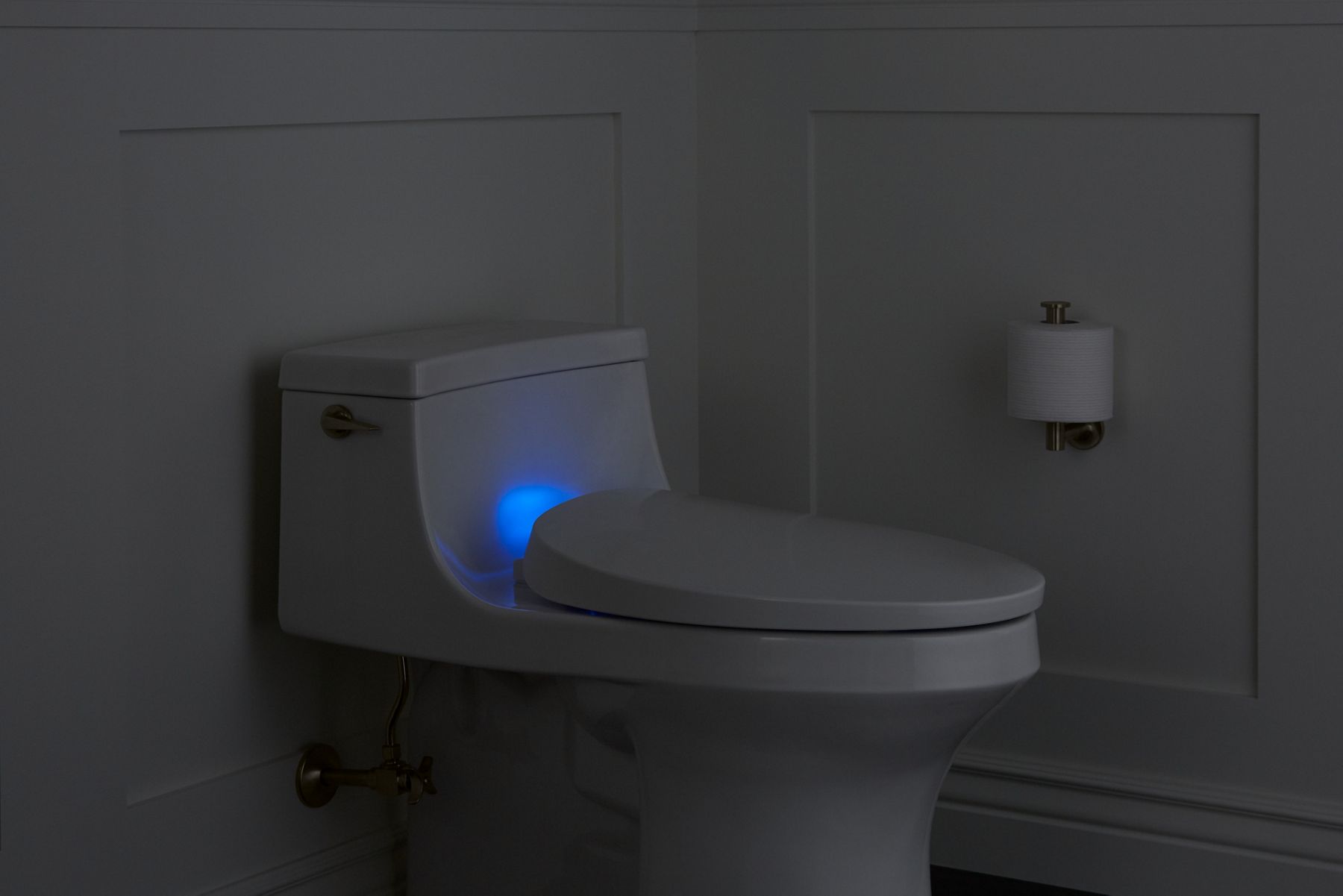 KOHLER smart toilet with blue nightlight in a dark room