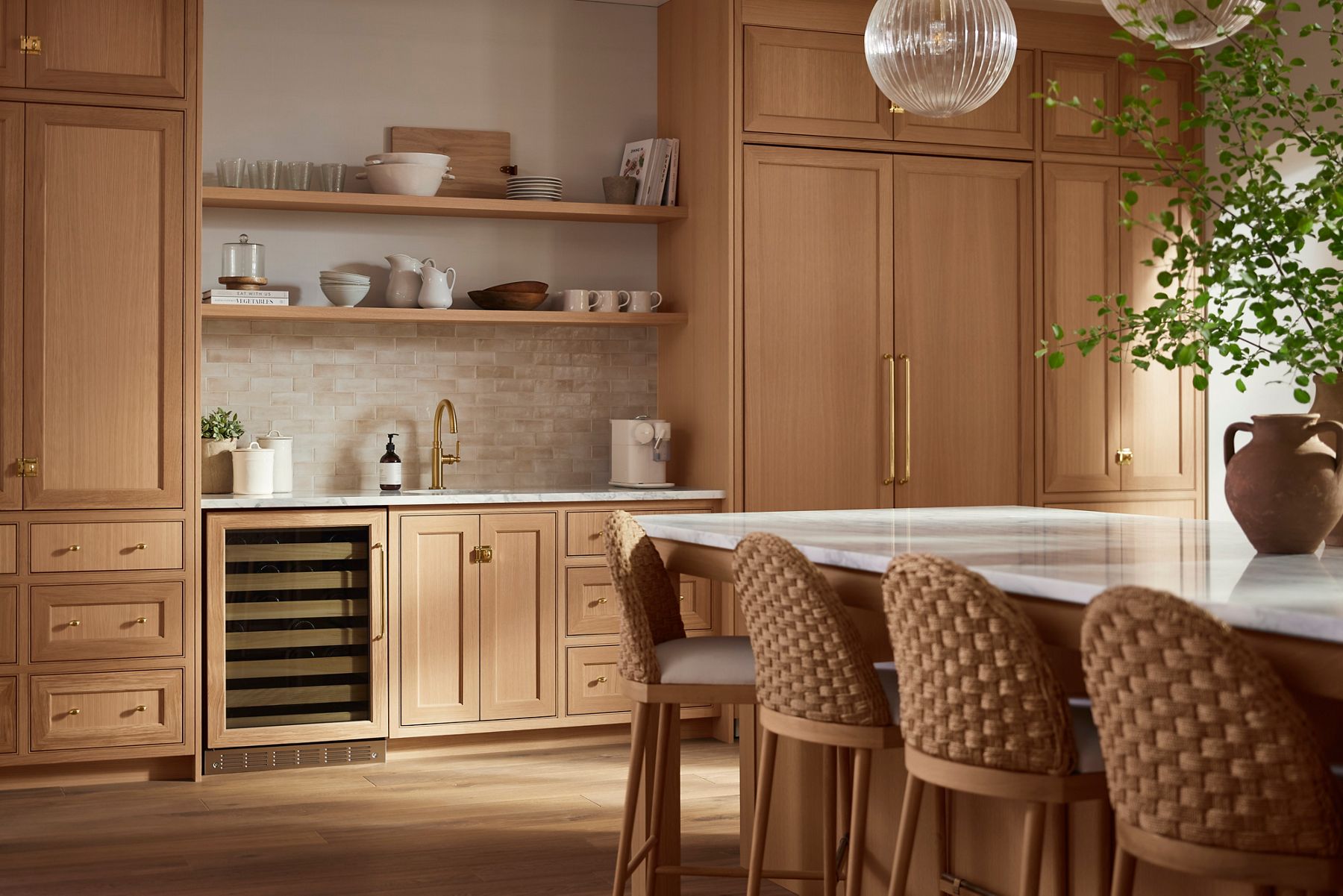 A bar sink area in a kithchen with a faucet designed by Shea McGee.