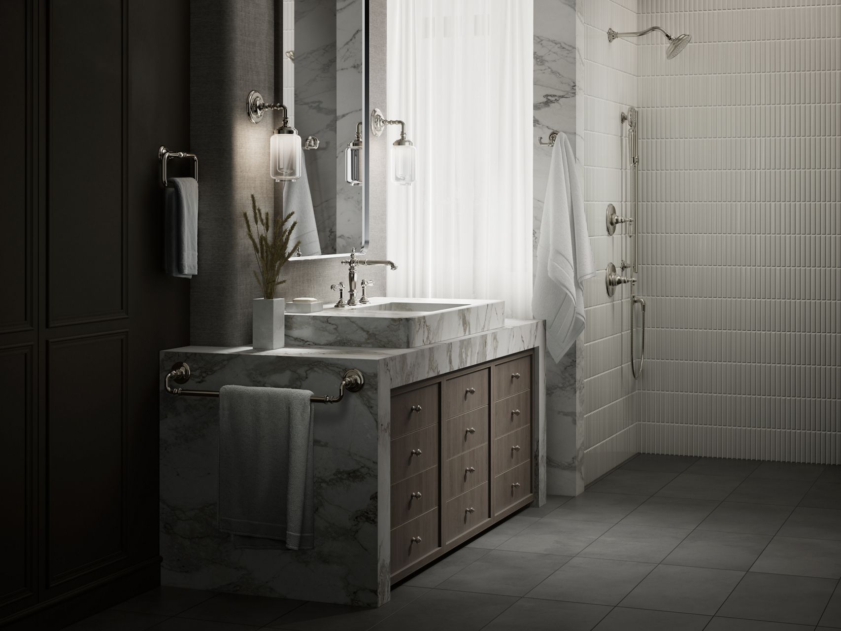 Luxury bathroom setup with a marble bathroom vessel sink and countertop, polished nickel faucet and hardware set, wall-mounted light fixtures, mirror, towel ring, towel bar, and a coordinating gold showering outlets with white textured tile backdrop.
