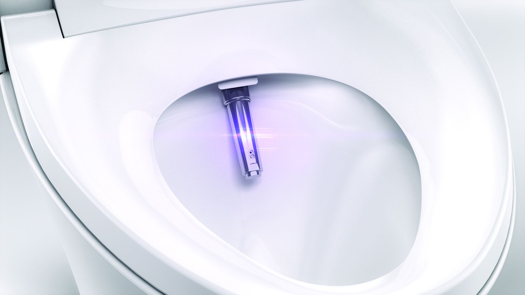 A video screen shot of the inside of a white toilet with a bidet wand extending into the bowl.