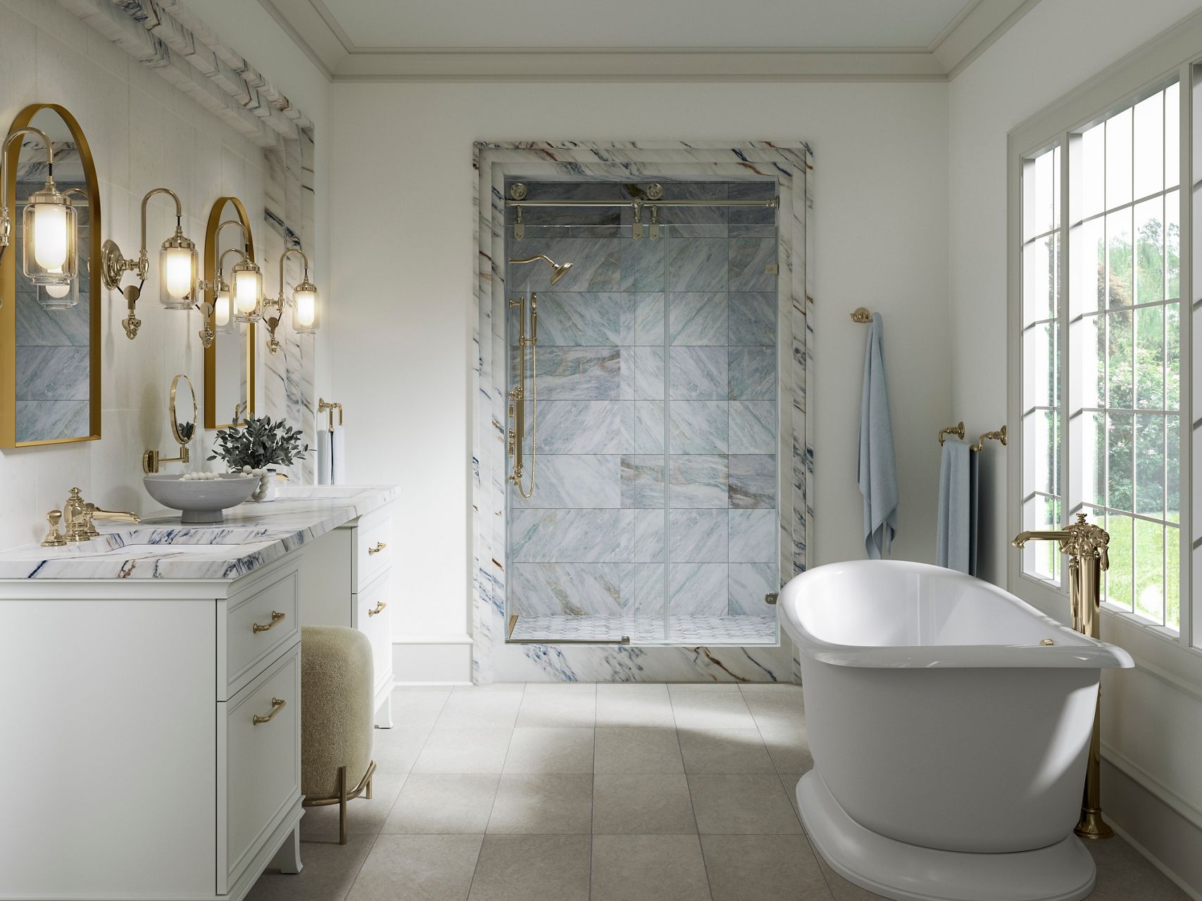 Bright marble bathroom with a freestanding white bathtub, glass-enclosed shower, double vanity, and polished brass fixtures.