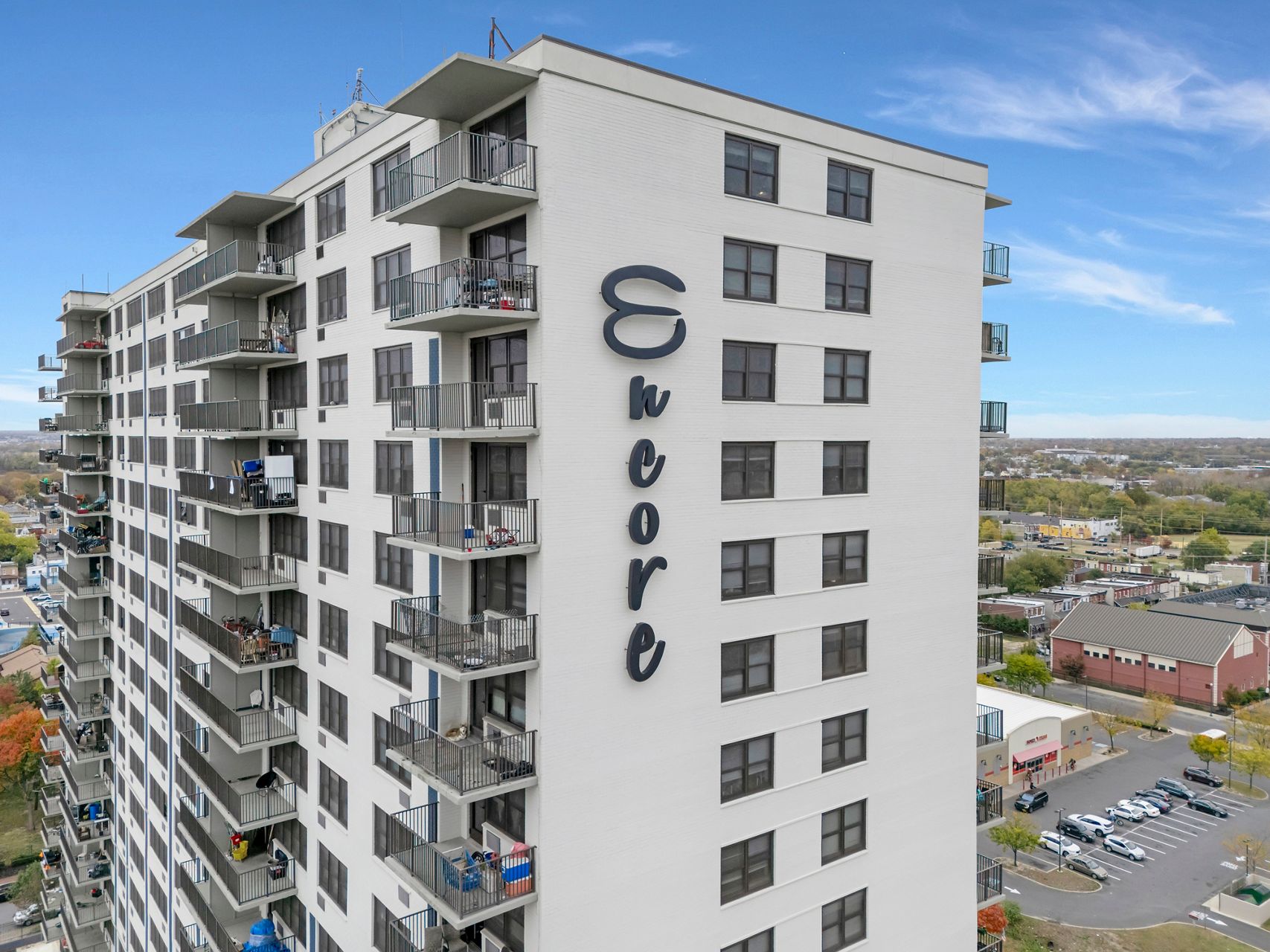 Encore luxury apartment building with the Camden, New Jersey skyline in the background.