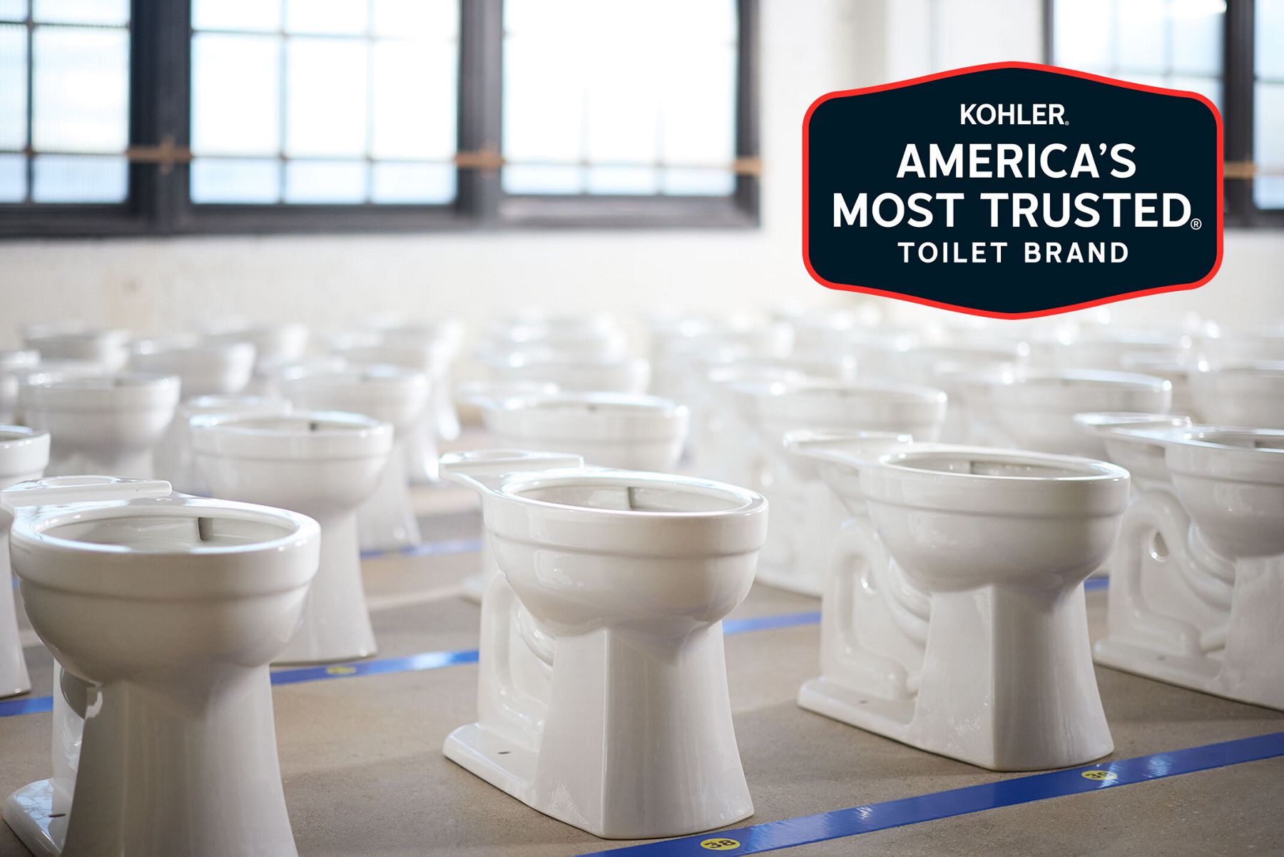A bright airy room filled with dozens of KOHLER Toilets at the inspection phase of manufacturing.