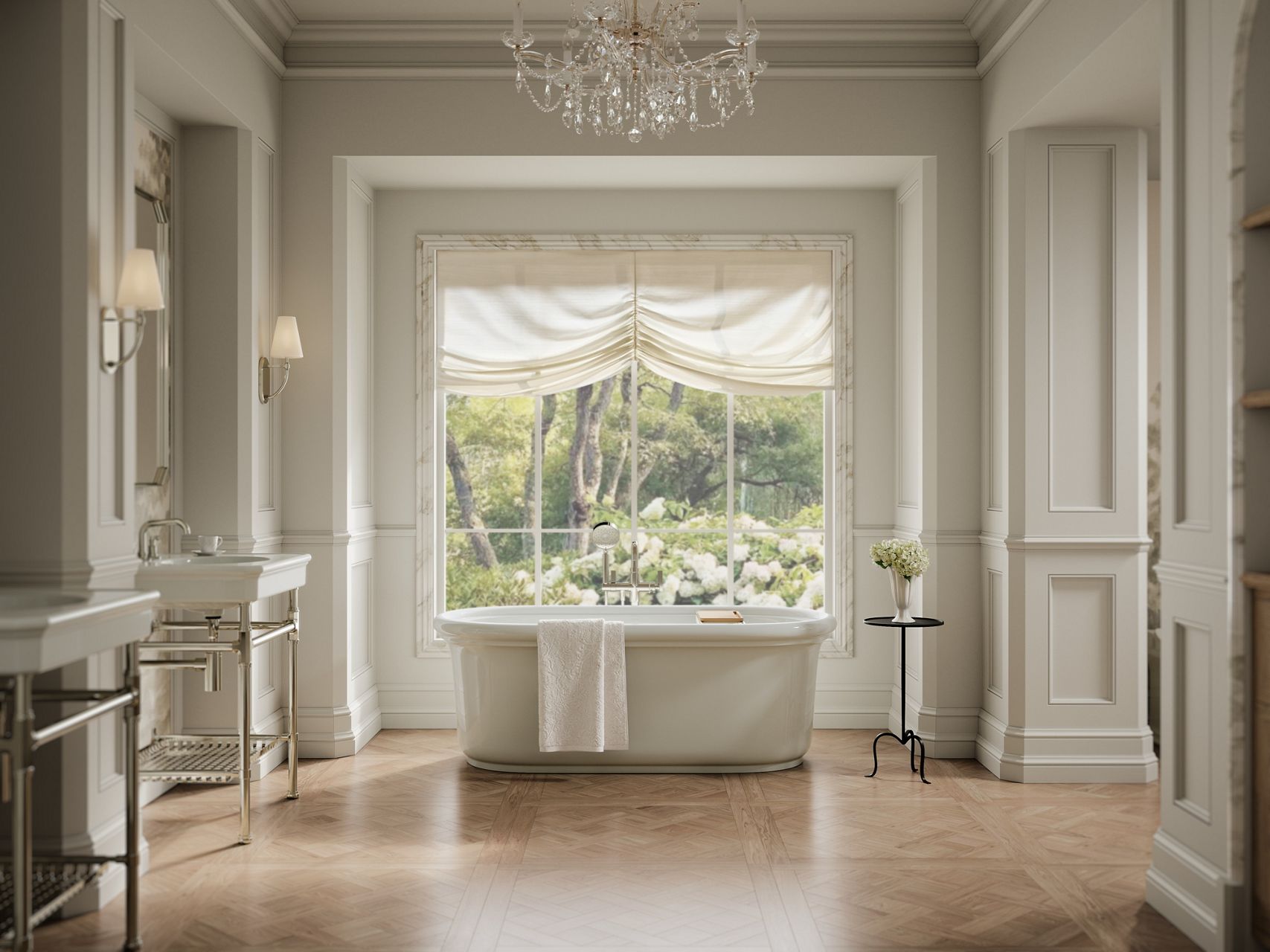 Elegant white bathroom with a freestanding bathtub centered beneath a large garden-view window, pedestal sinks, and warm wood flooring.
