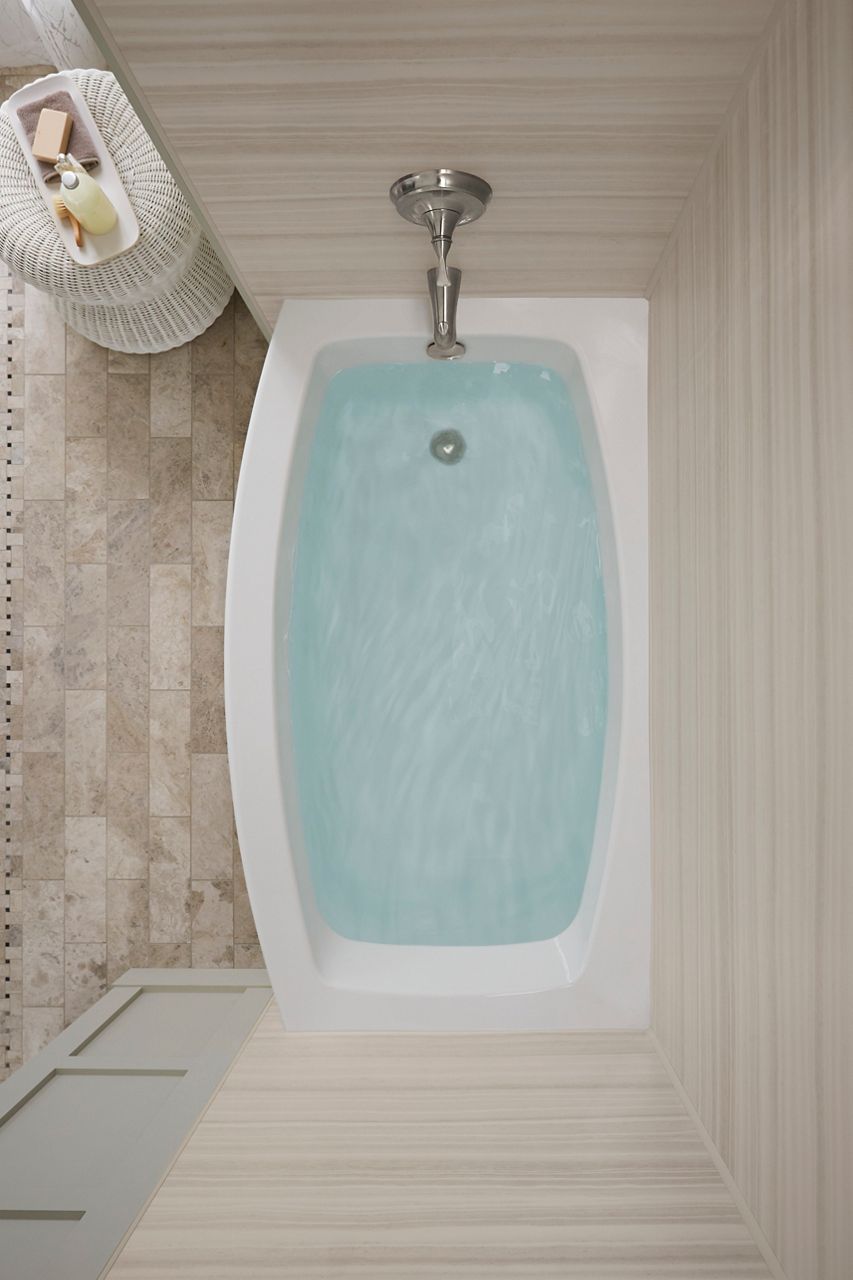 Overhead view of an alcove bath with the apron side bowing out to provide more bathing space.