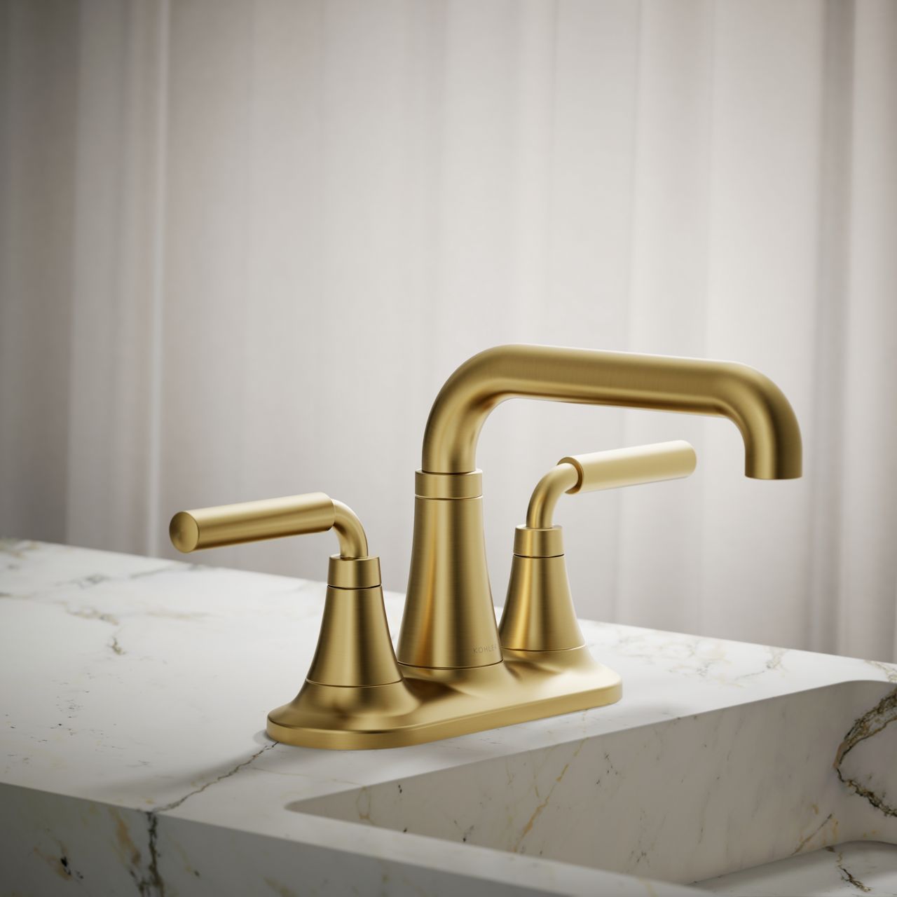 Brushed gold two-handle centerset faucet with modern curved spout