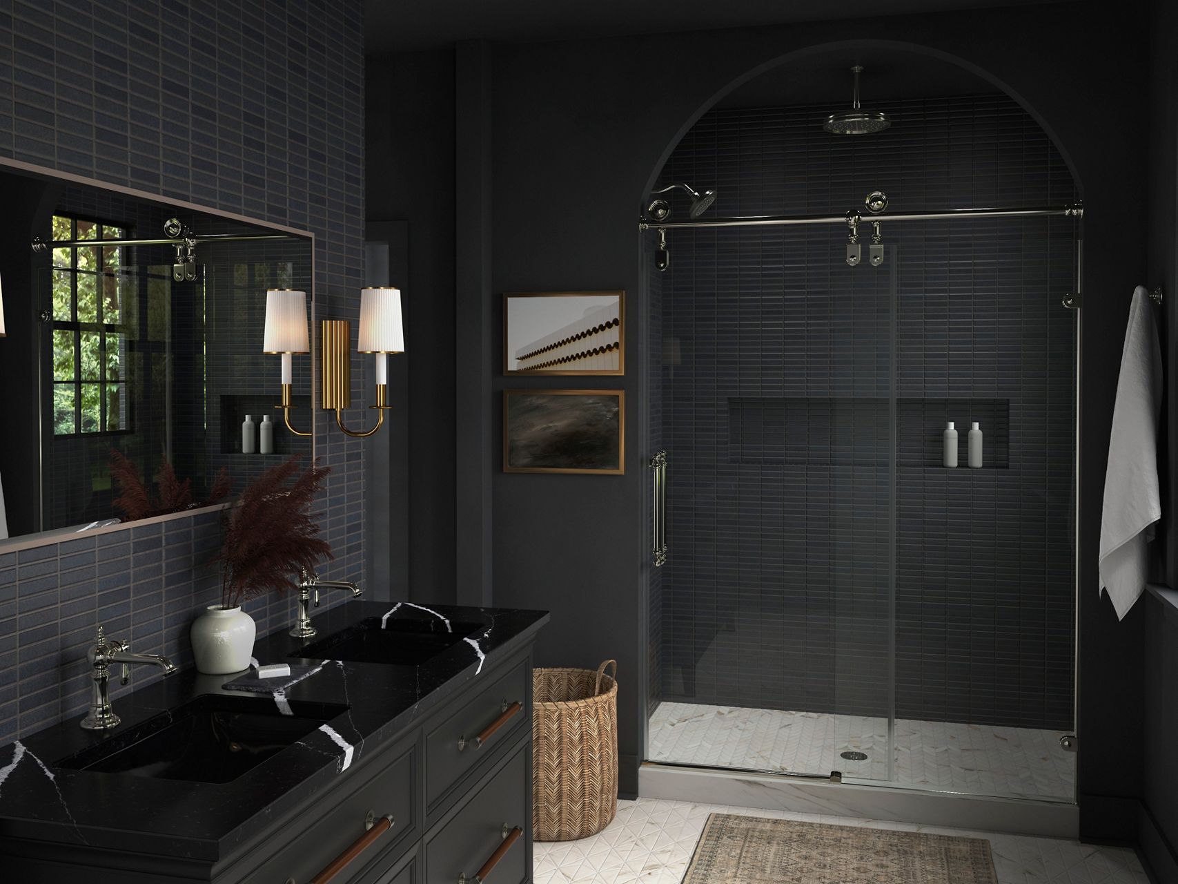 A bathroom with dark tiled walls and walk in shower, Tresdoux wall sconce, and black double vanity and vanity top with KOHLER Artifacts single handle faucets in Polished Nickel.