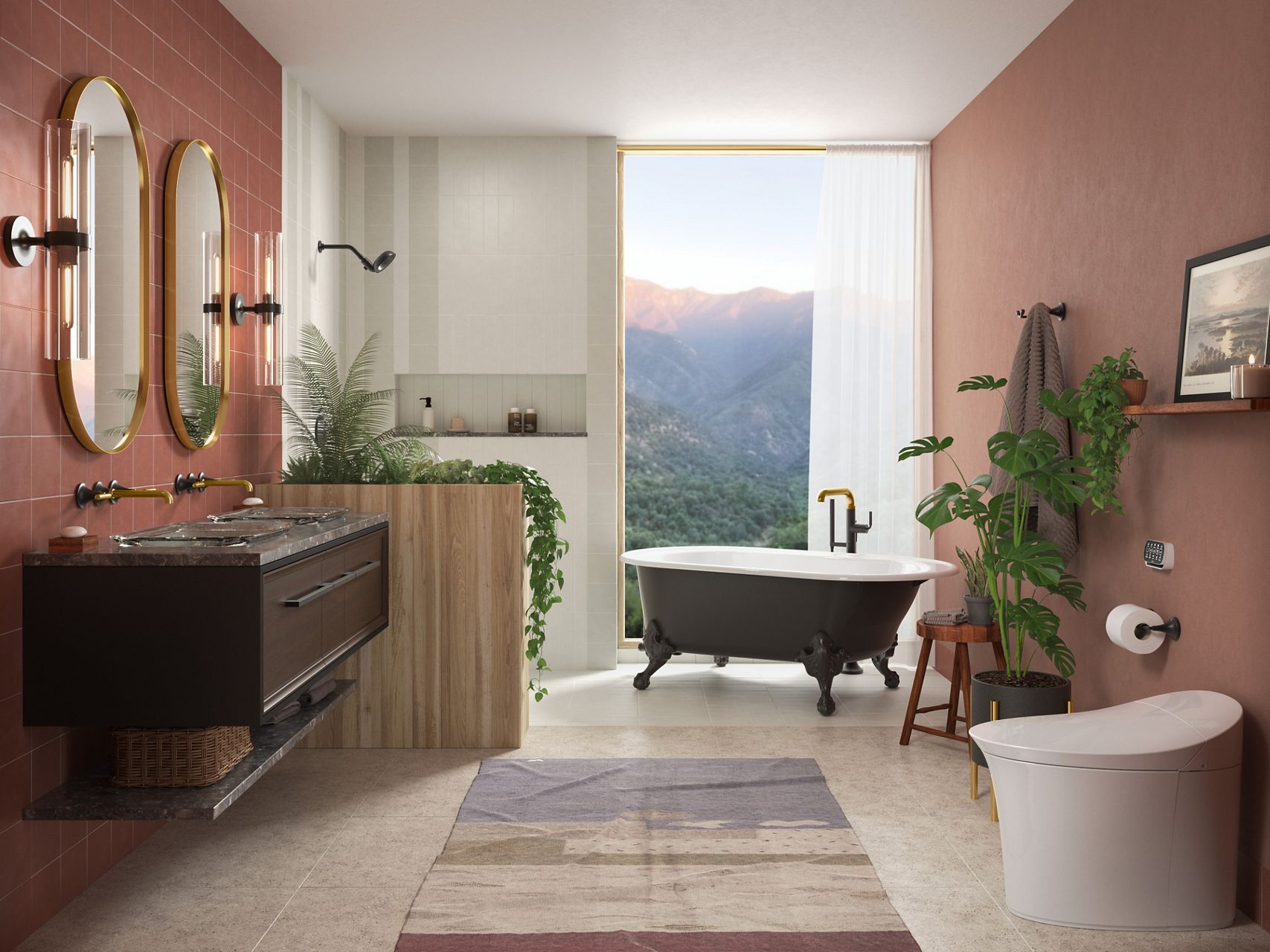 A large bathroom in tones of dark pastel pink and white with black and brass accents, with a double vanity on the left, a toilet on the right, and a shower and freestanding bath in the rear ground with a floor-to-ceiling window behind them looking out over a mountain sunrise.