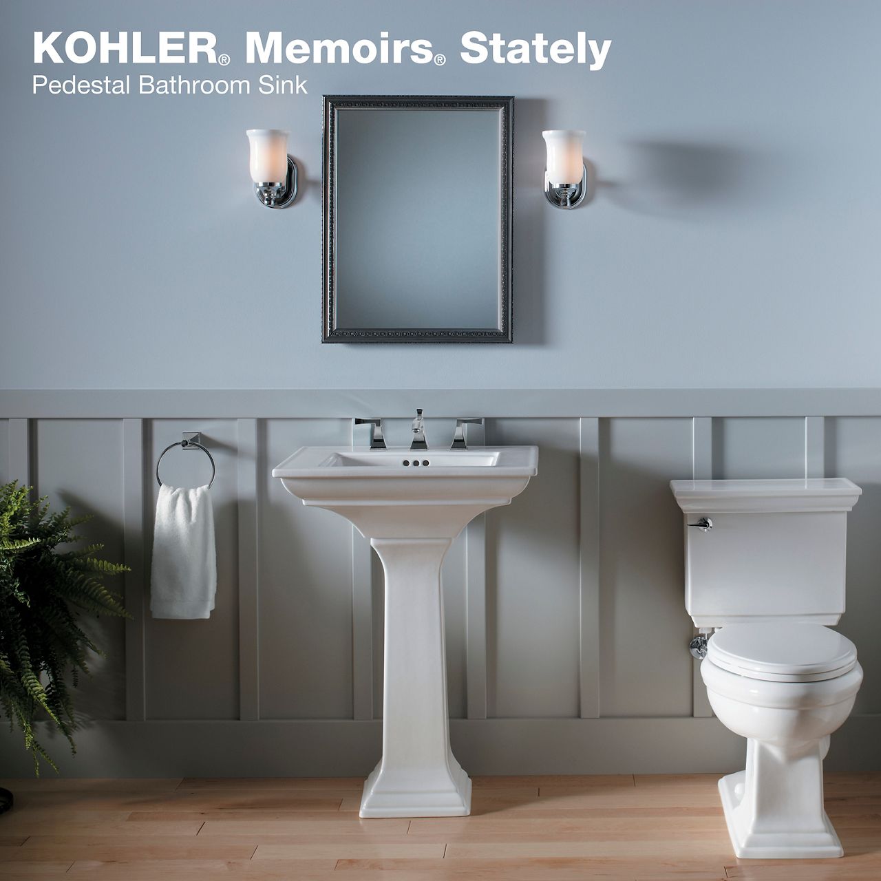 Classic white pedestal sink and toilet in vintage-style bathroom
