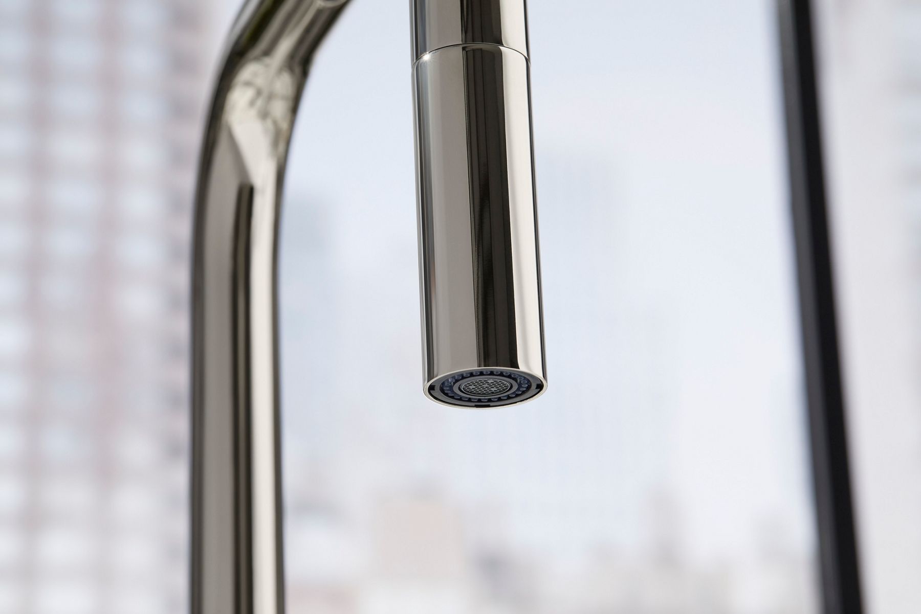 Detail of a faucet spray face.