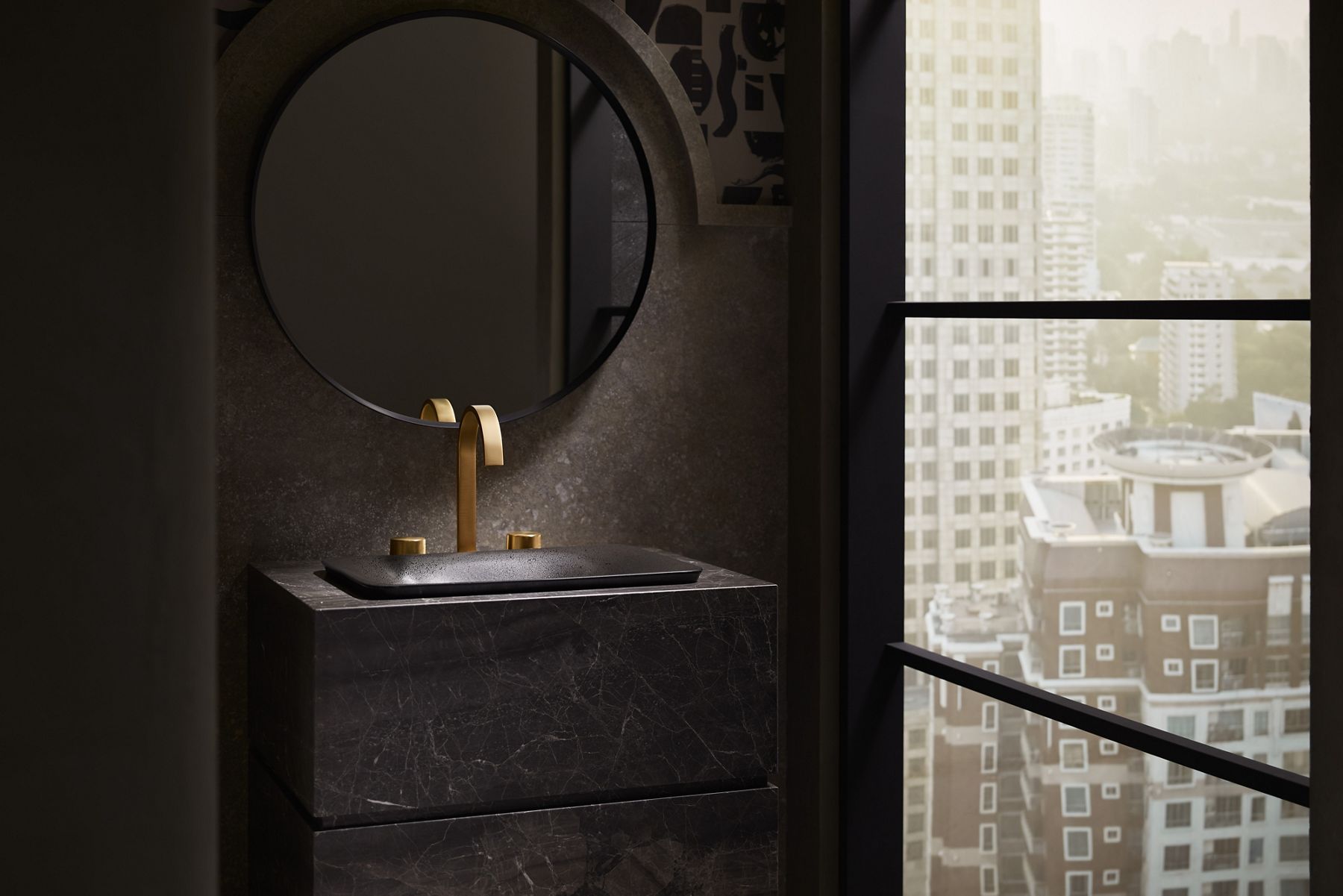 Compact dark bathroom with round mirror and ambient lighting