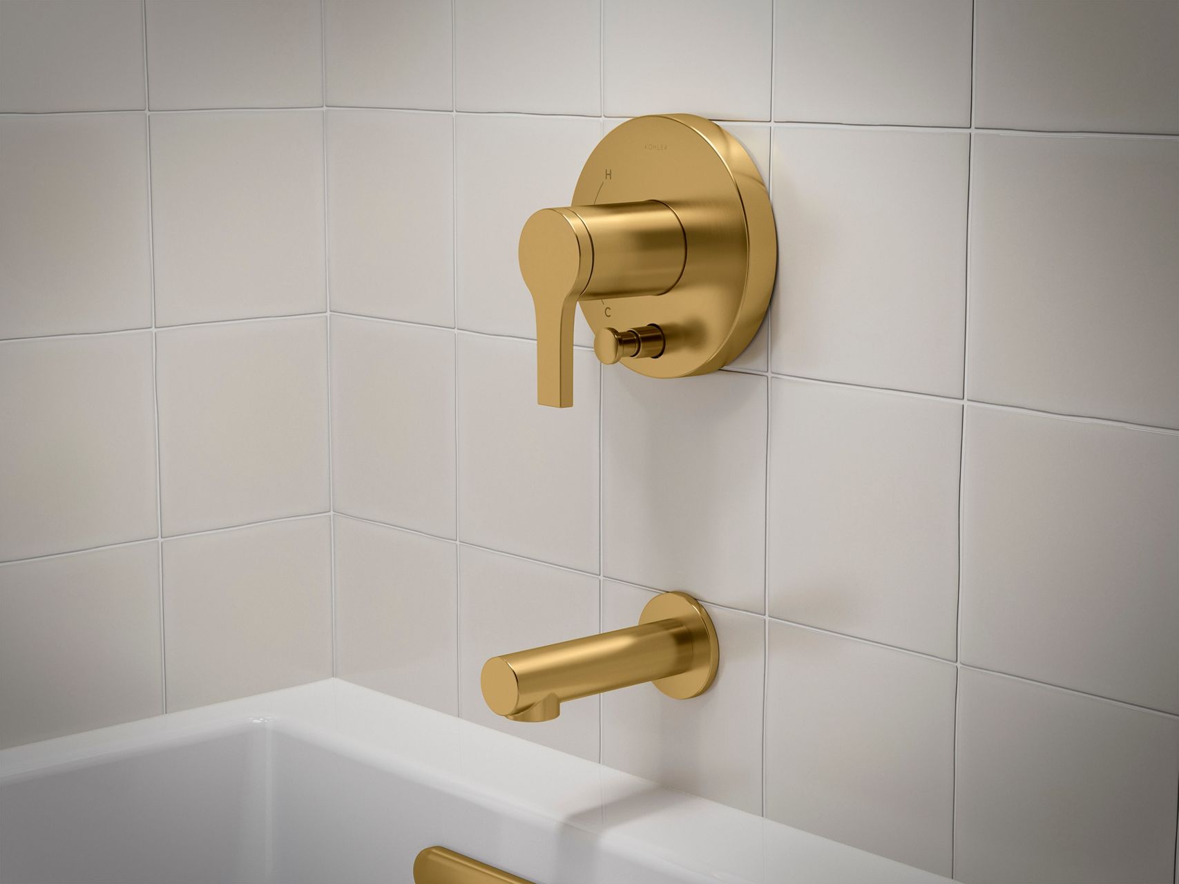 Brushed gold bath and shower trim kit with wall mounted handle and spout.