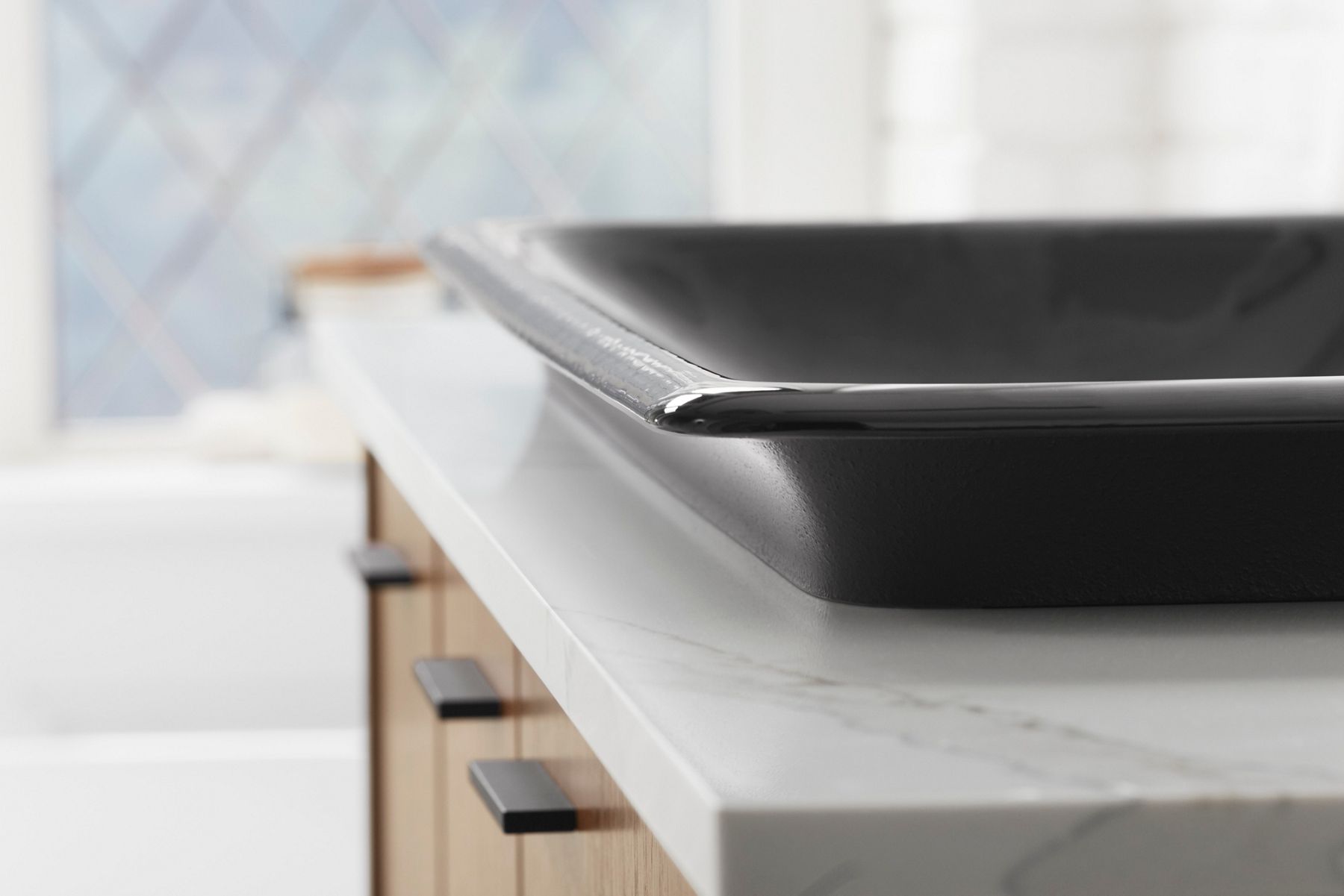 Matte black rectangular enameled cast iron sink with soft edge design