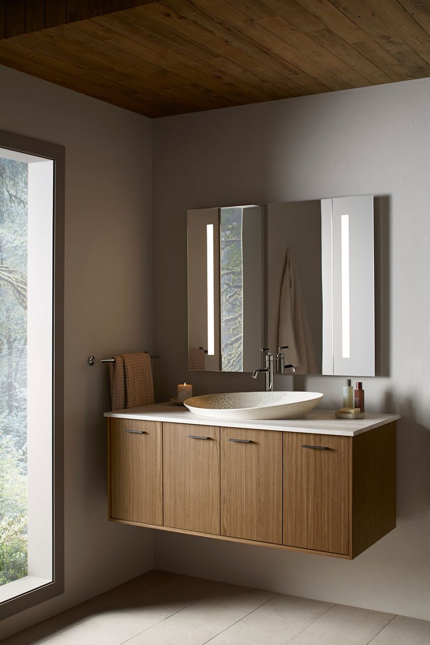 Minimalist bathroom with slim rectangular LED mirrors above a floating wood vanity and vessel sink.