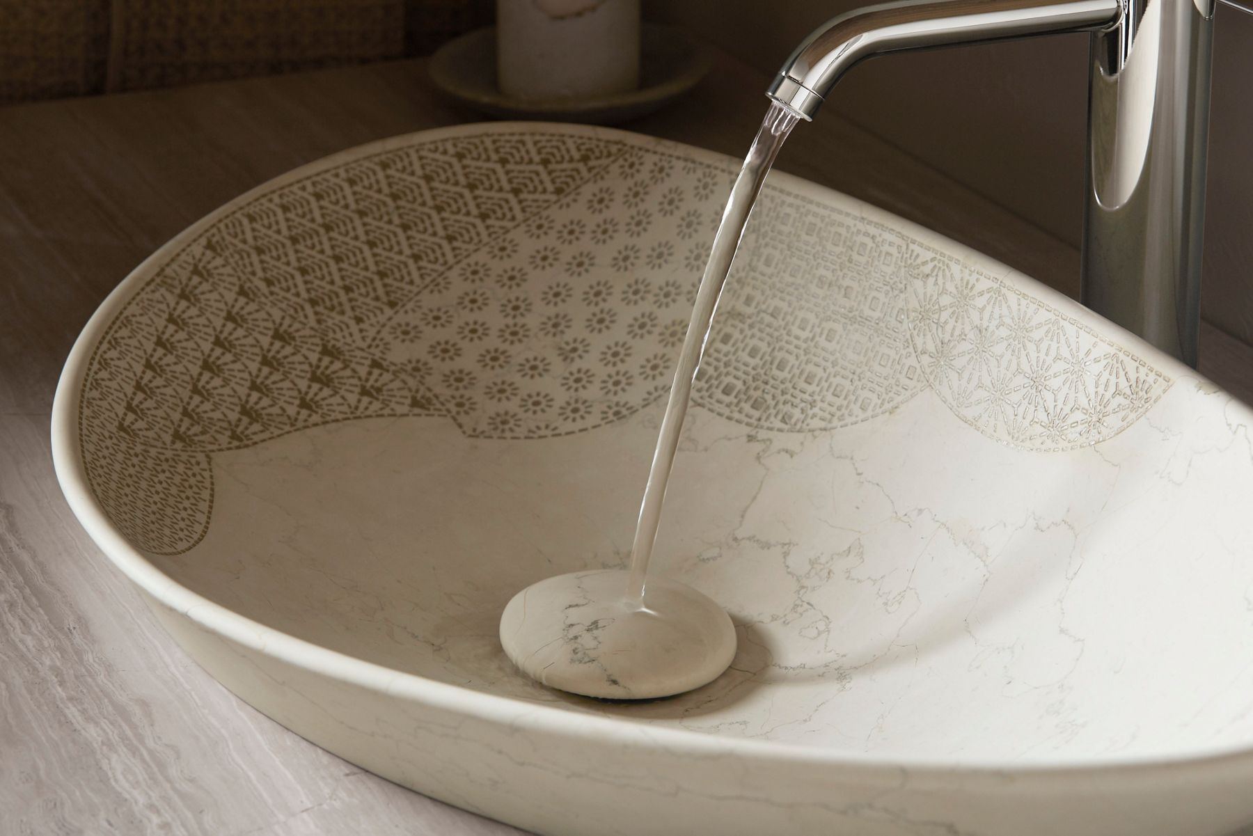 Cream ceramic vessel sink with gentle water flow