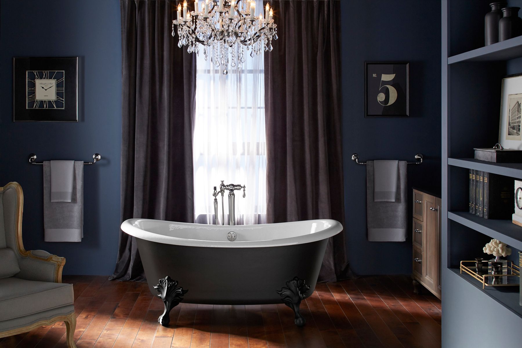 An Artifacts freestanding bath under a curtained window.